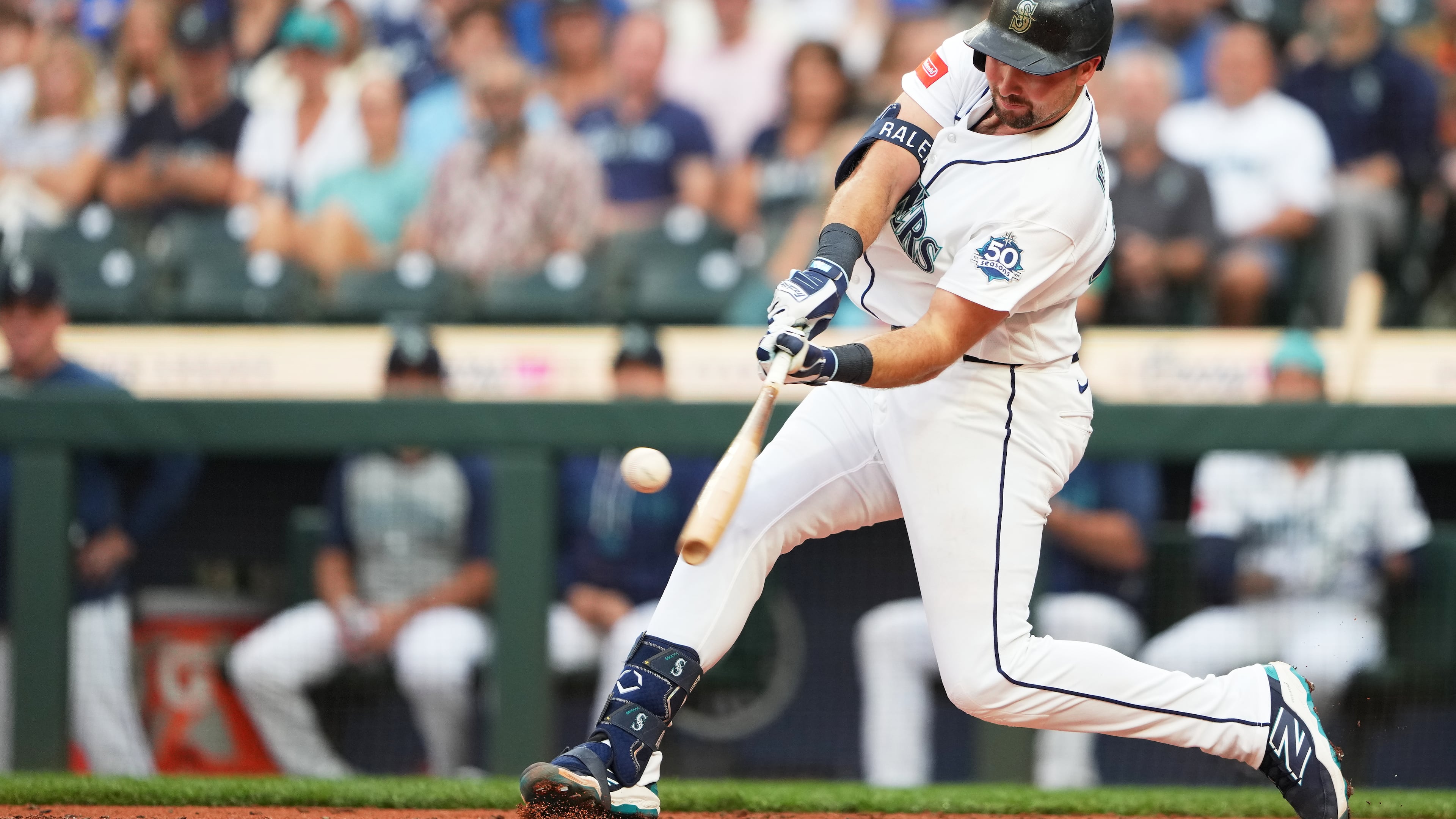 Seattle Mariners' Cal Raleigh hits a solo home run during the second inning of a baseball game against the Philadelphia Phillies, Tuesday, Aug. 25, 2026, in Seattle. (AP Photo/Lindsey Wasson)