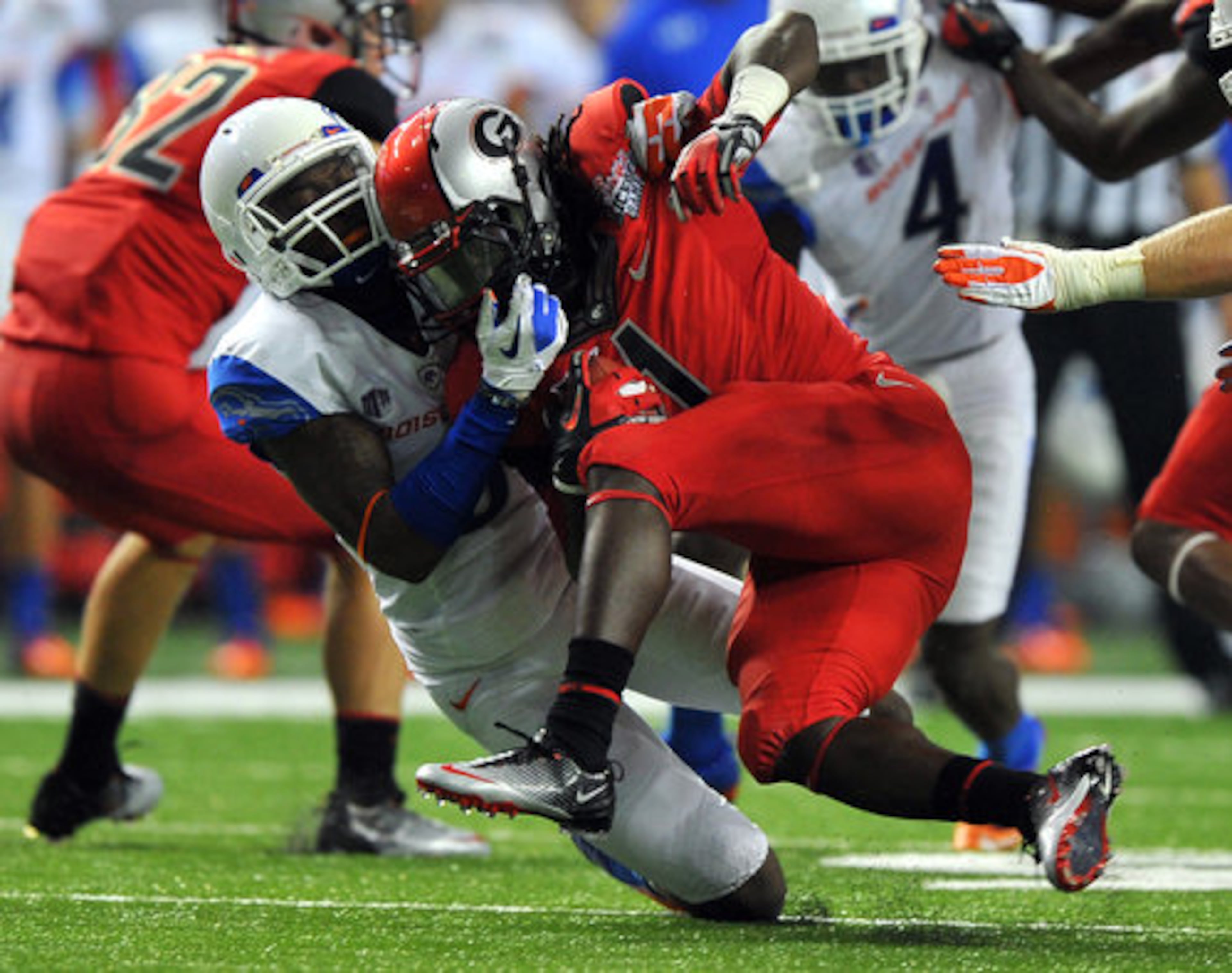 Georgia running back Isaiah Crowell is tackled by Boise State's George Iloka.