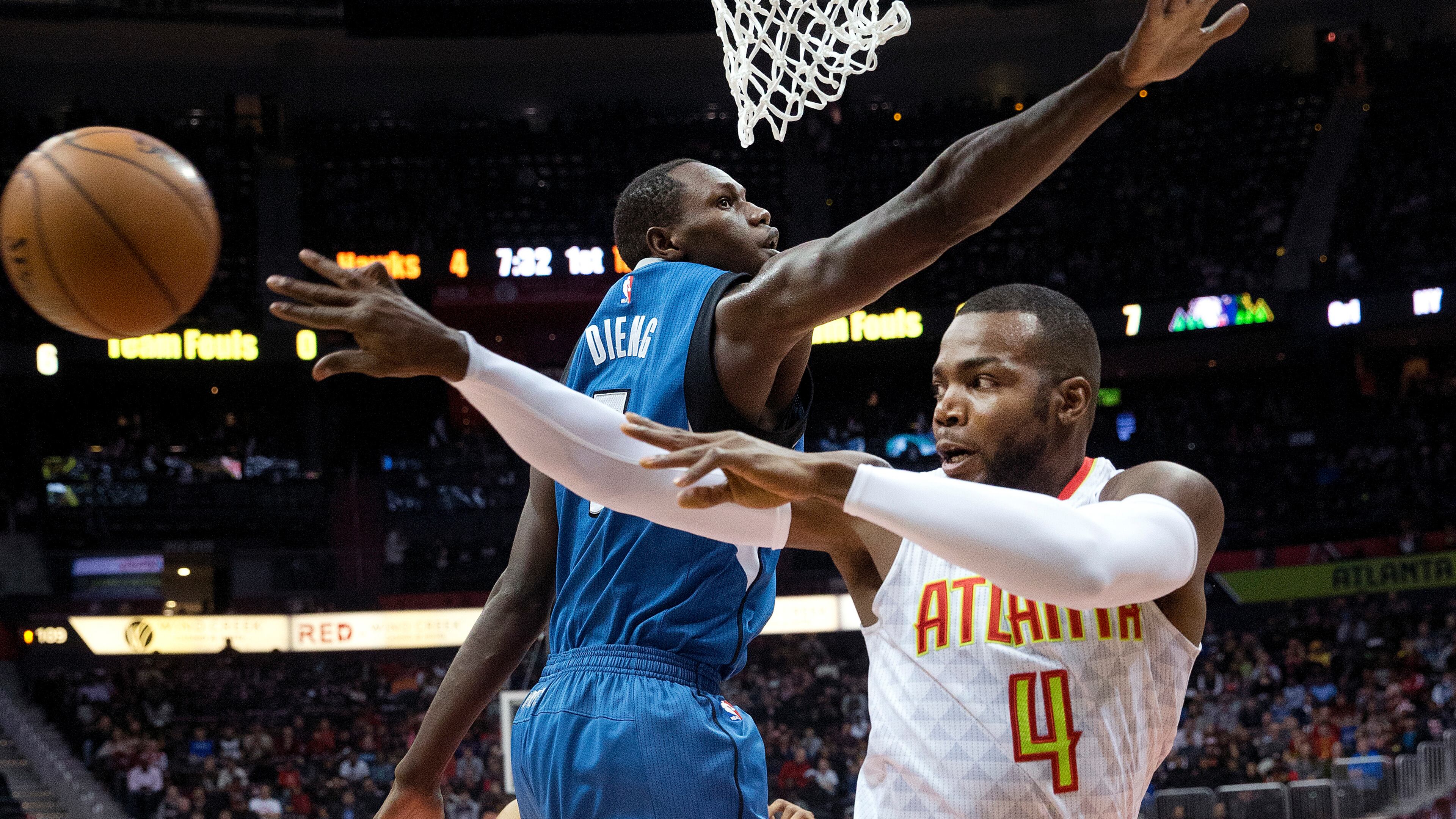 Atlanta Hawks forward Paul Millsap (4) passes against Minnesota Timberwolves forward Gorgui Dieng (5) in the first half of an NBA basketball game Wednesday, Dec. 21, 2016, in Atlanta. (AP Photo/John Bazemore)