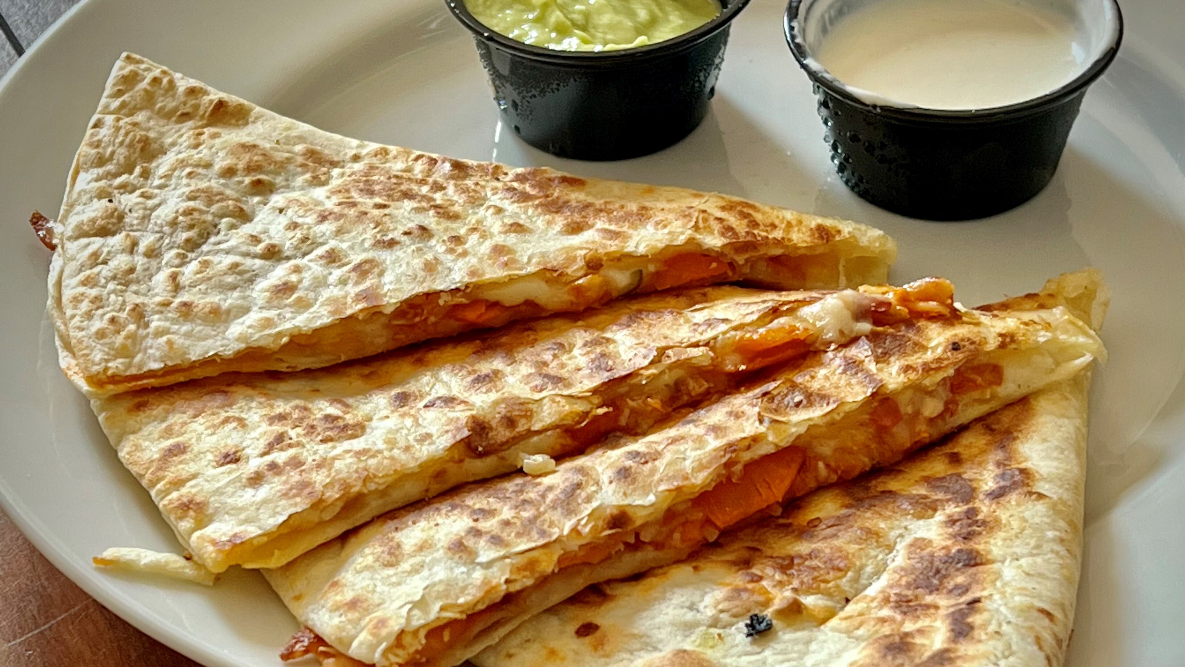 El Burro Pollo's kimchi quesadilla uses house-made kimchi to brighten up an already wonderful cheese quesadilla. Henri Hollis/henri.hollis@ajc.com