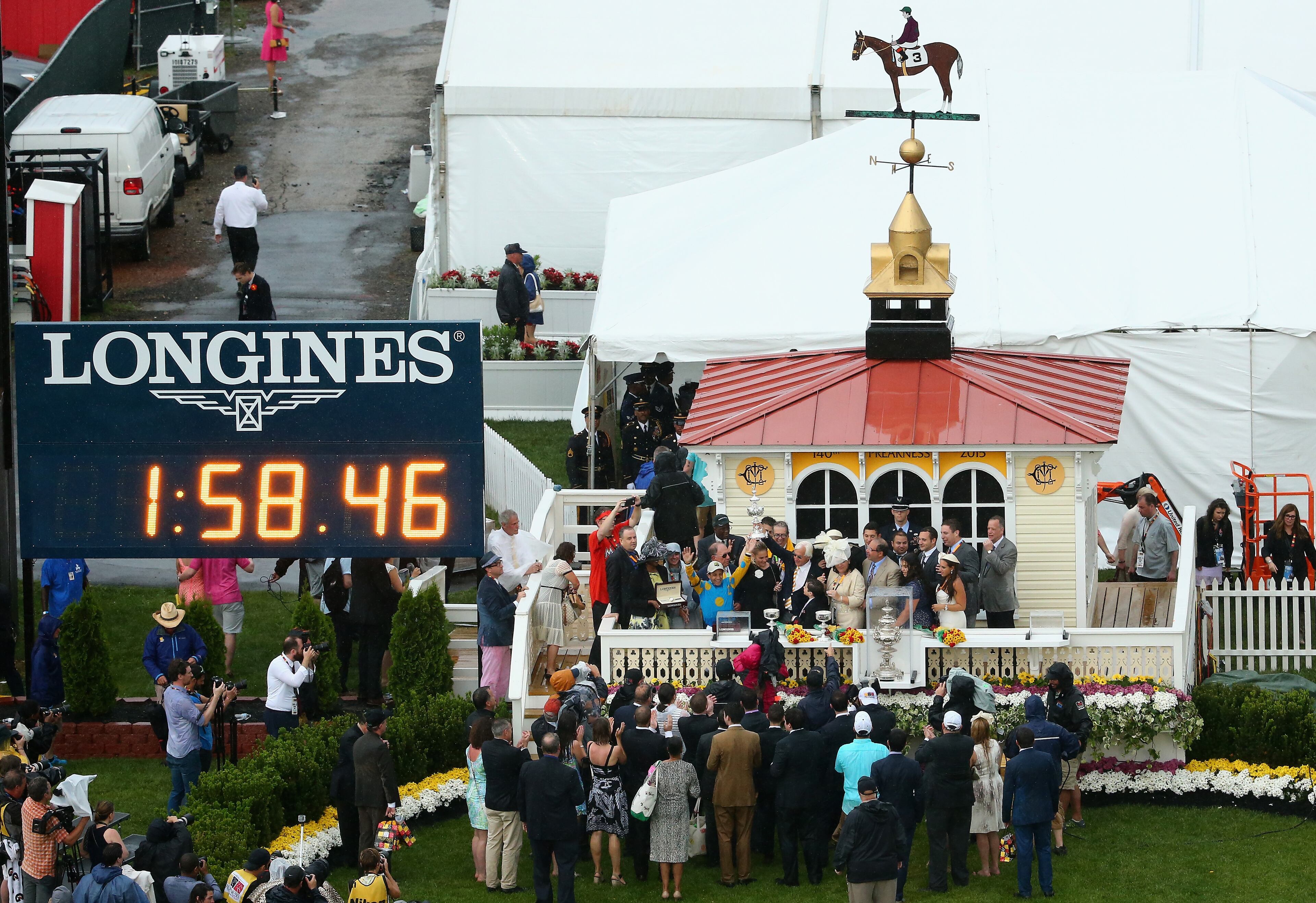 BALTIMORE, MD - MAY 16: Victor Espinoza and Bob Baffert celebrate in the winners circle following American Pharoah's win in the 140th running of the Preakness Stakes at Pimlico Race Course on May 16, 2015 in Baltimore, Maryland. (Photo by Maddie Meyer/Getty Images)