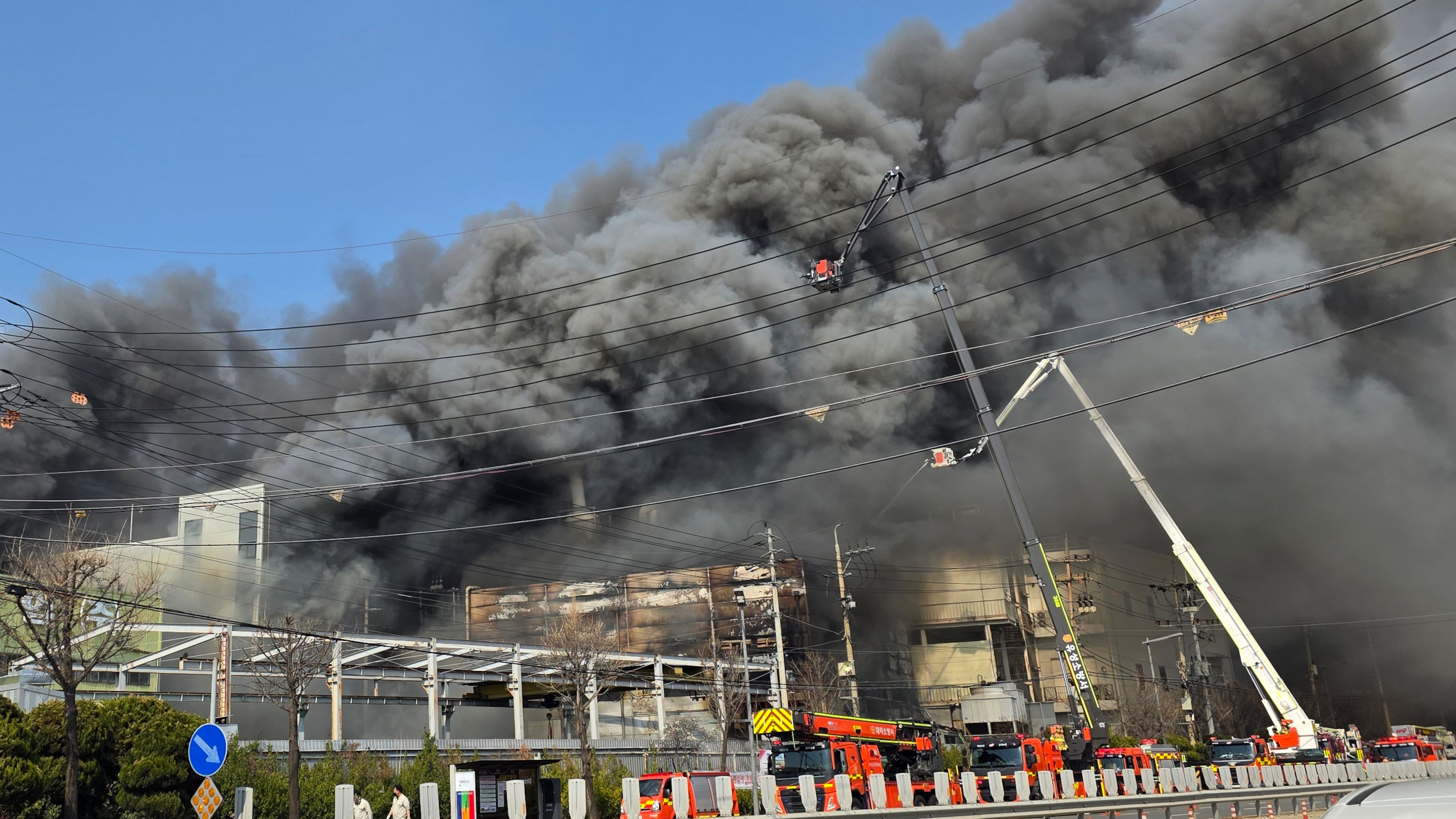 Black smoke rises from an auto parts plant in Daejeon, South Korea, Friday, March 20, 2026. (Kim So-yeon/Yonhap via AP)