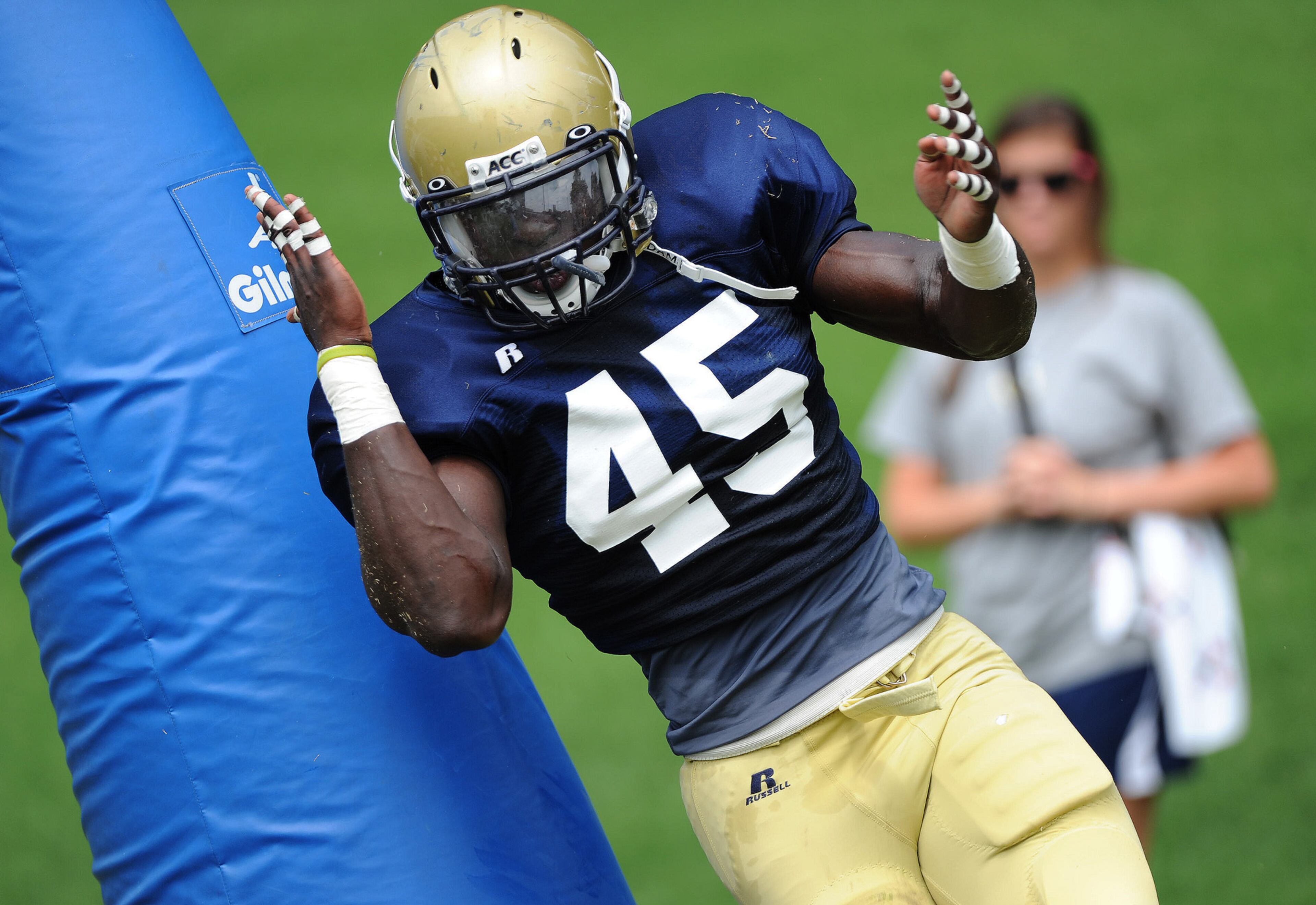 This isn't the best example, but former Georgia Tech defensive end Jeremiah Attaochu shows his bend in getting around a blocking dummy in a Tech practice in 2011. AJC file photo by Johnny Crawford