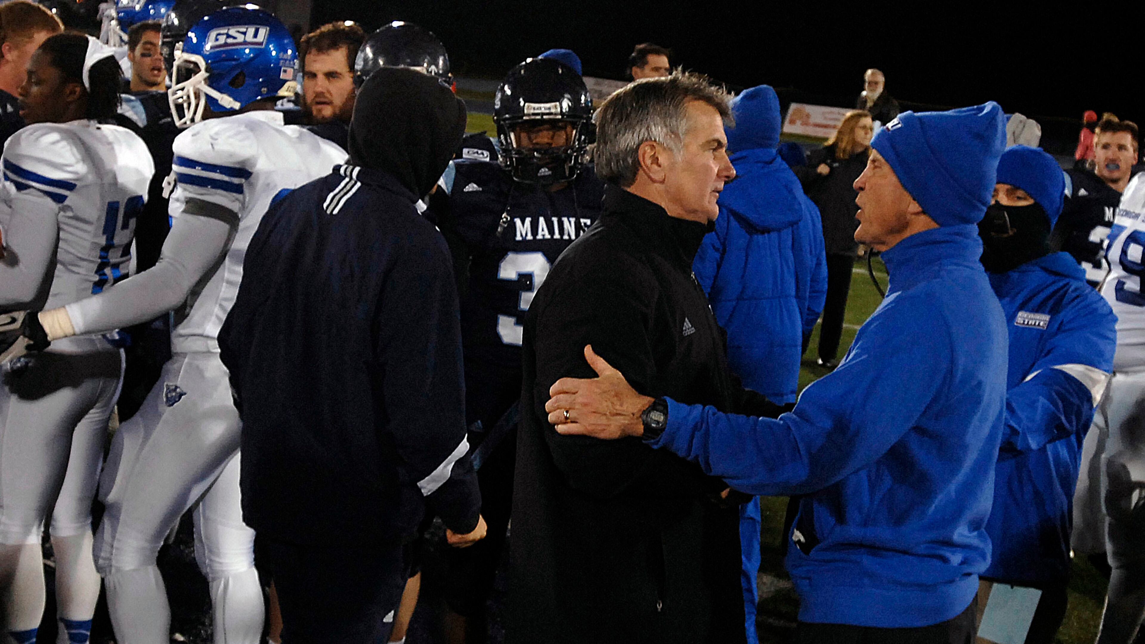 Curry and Maine coach Jack Cosgrove meet on the field after the game. The Panthers lost to the Black Bears 51-7 in the final game of Curry's coaching career.