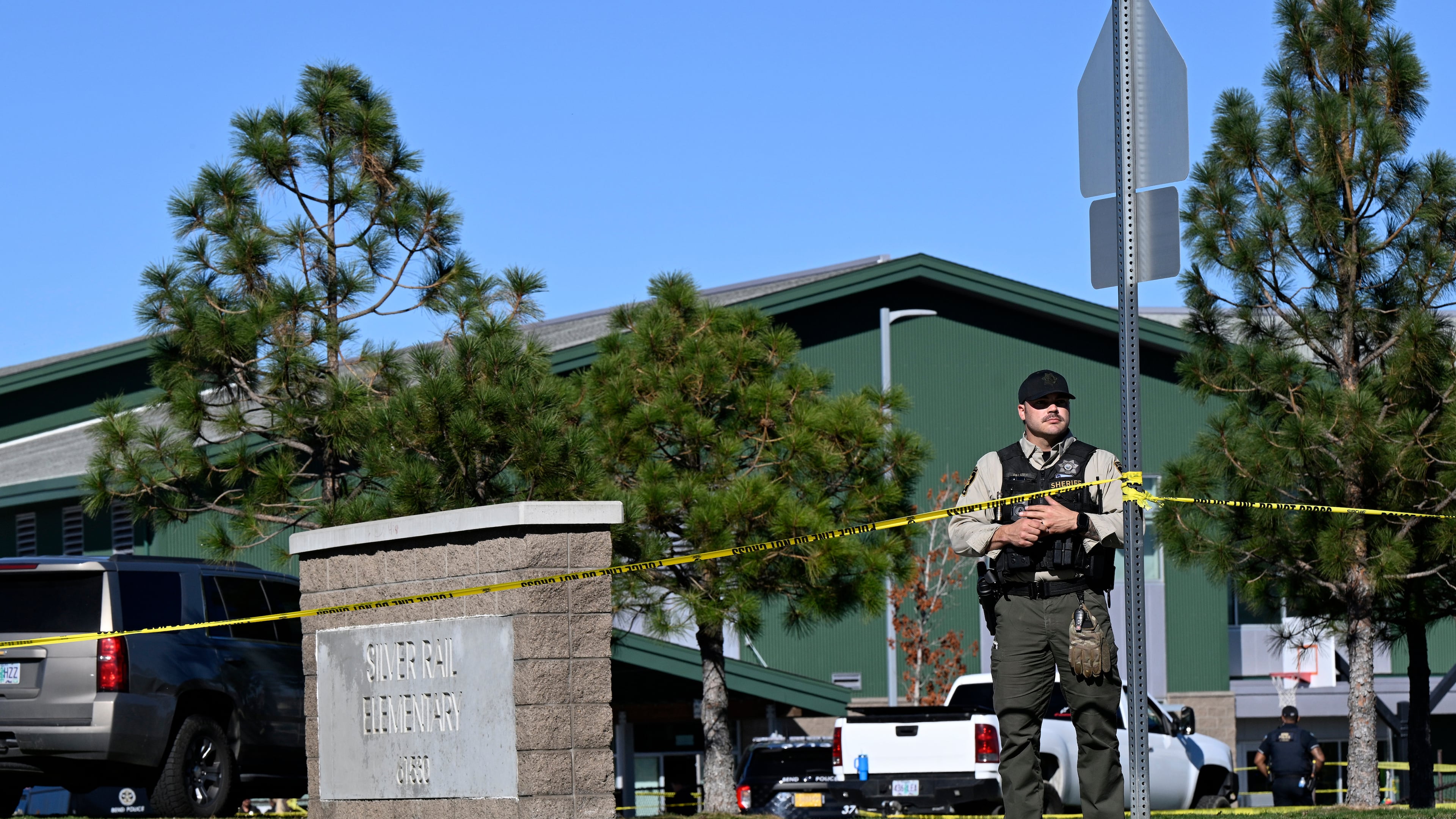 Police tape is placed outside Silver Rail Elementary school, where a shooting took place, on Thursday, Oct. 15, 2026 in Bend, Ore. (AP Photo/Joe Kline)