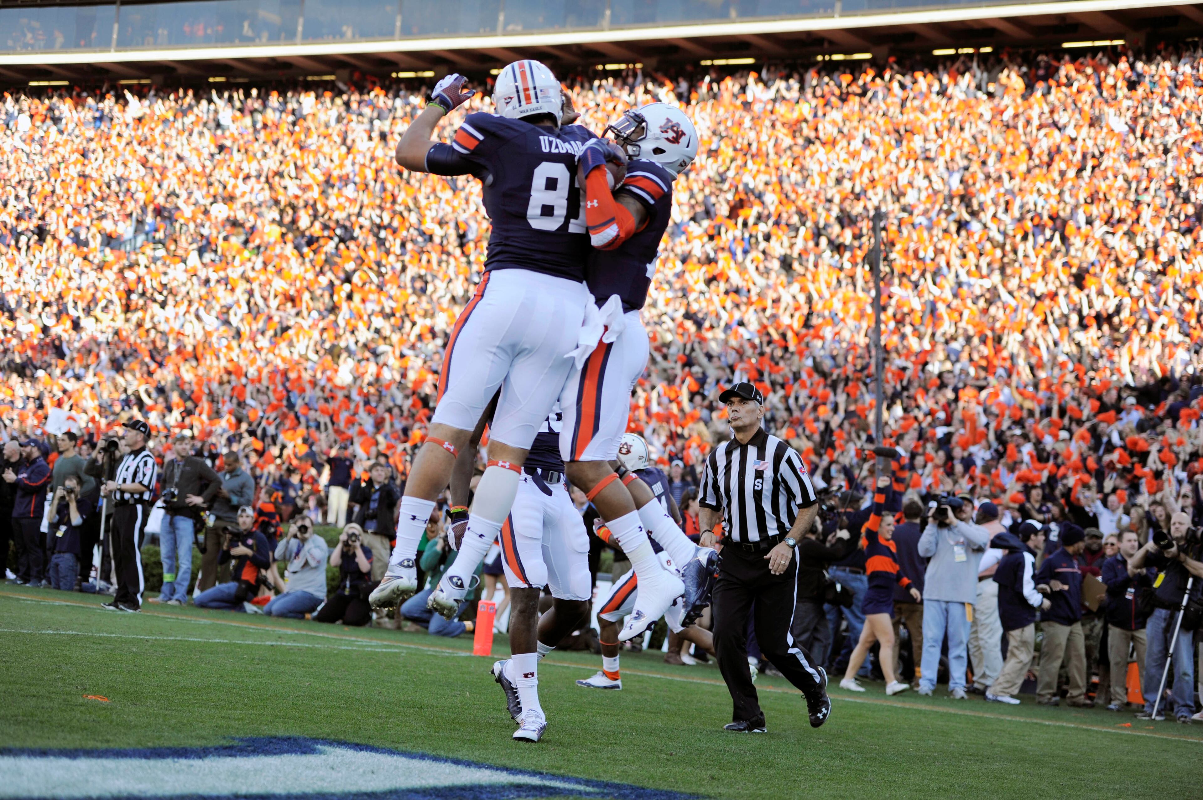 Auburn Tigers quarterback Nick Marshall (14) celebrates with C.J. Uzomah (81) after scoring on a 45 yard touchdown run against the Alabama Crimson Tide in the first quarter at Jordan Hare Stadium.
