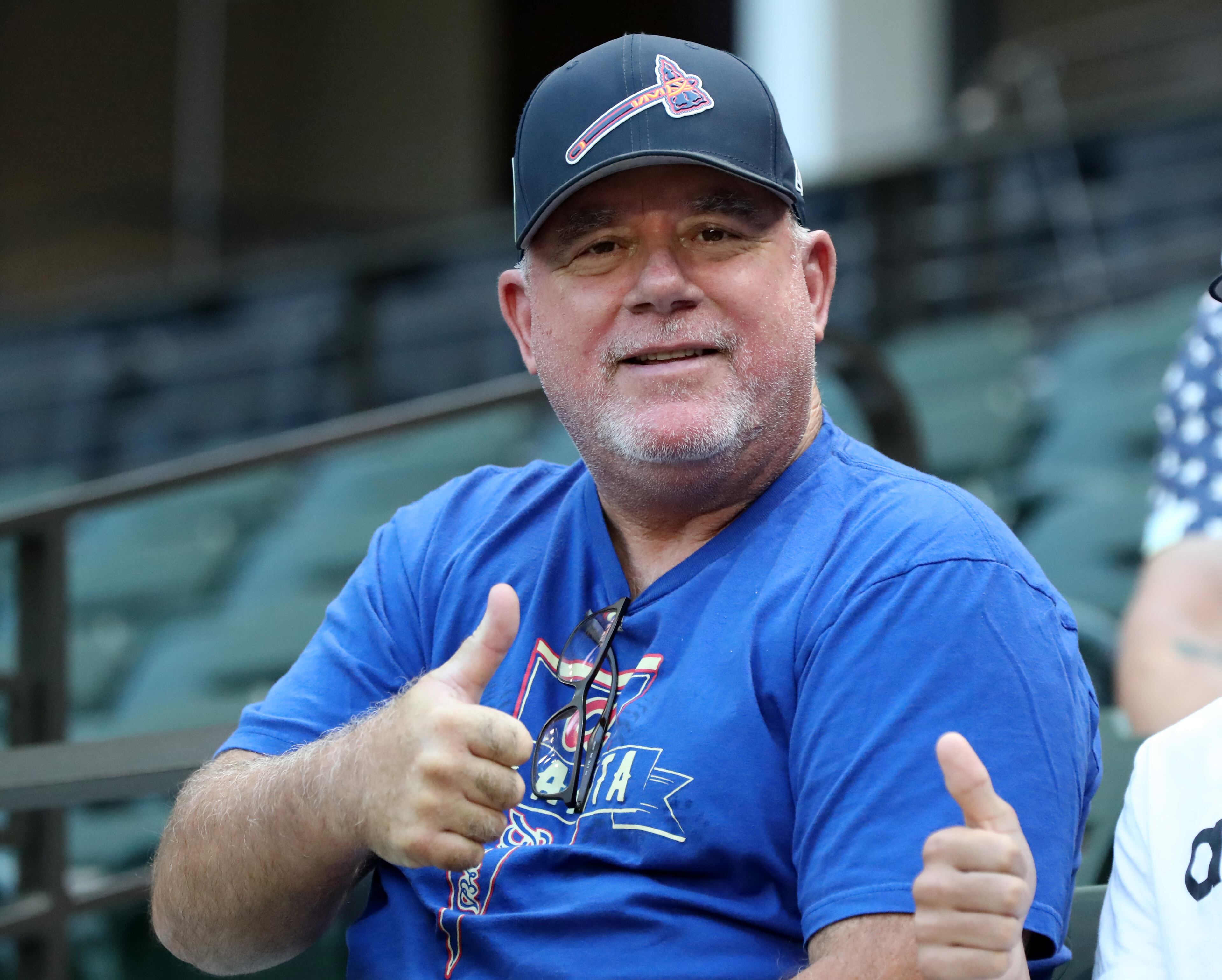 Braves fan Tom Shaddix of Austin, Tx. gives the thumbs up before Monday's Game 1 of the National League Championship Series in Arlington, Tx.