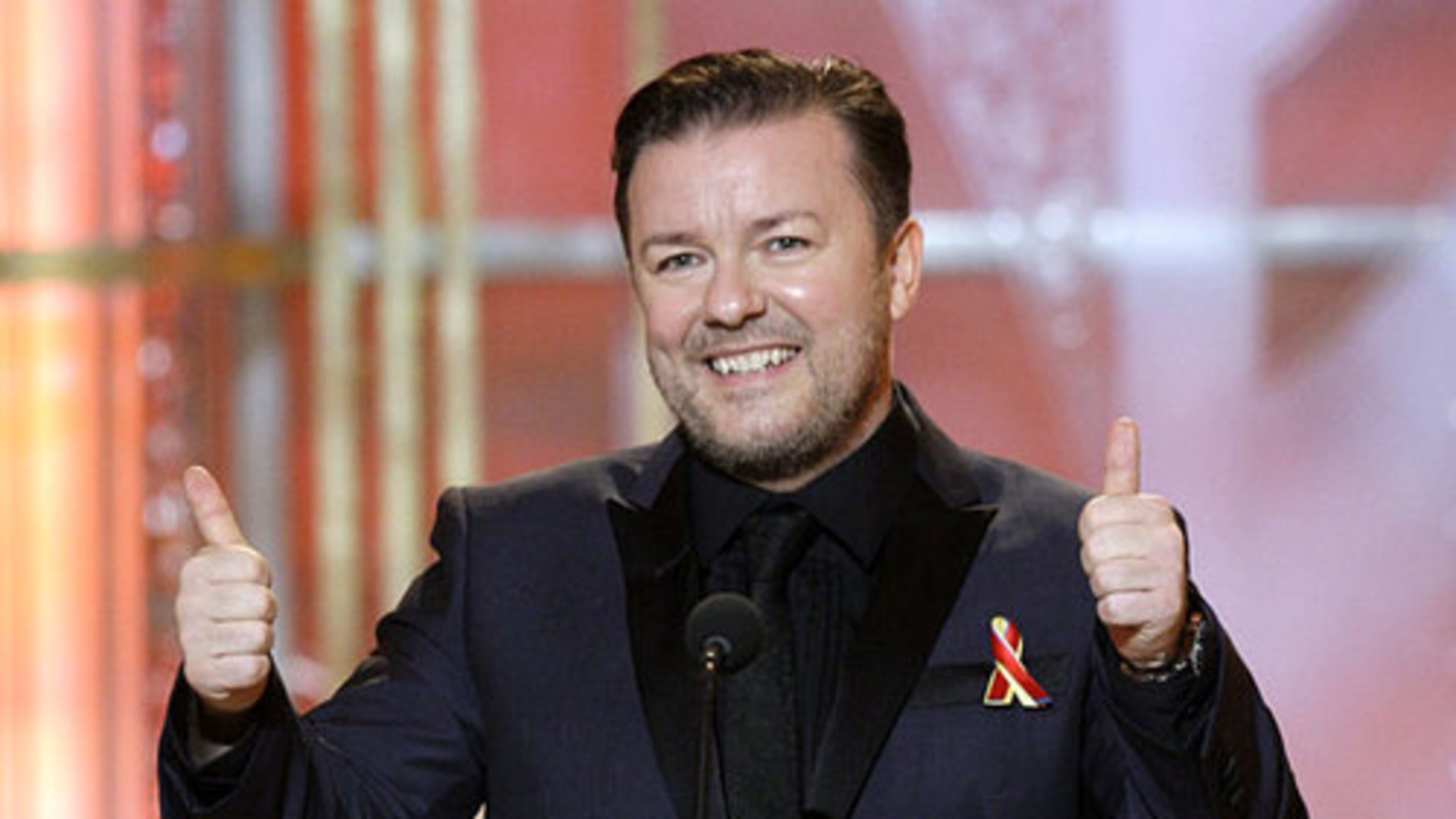 Host Ricky Gervais gestures on stage. Gervais treated the event as a roast, throwing good-natured insults throughout the night.