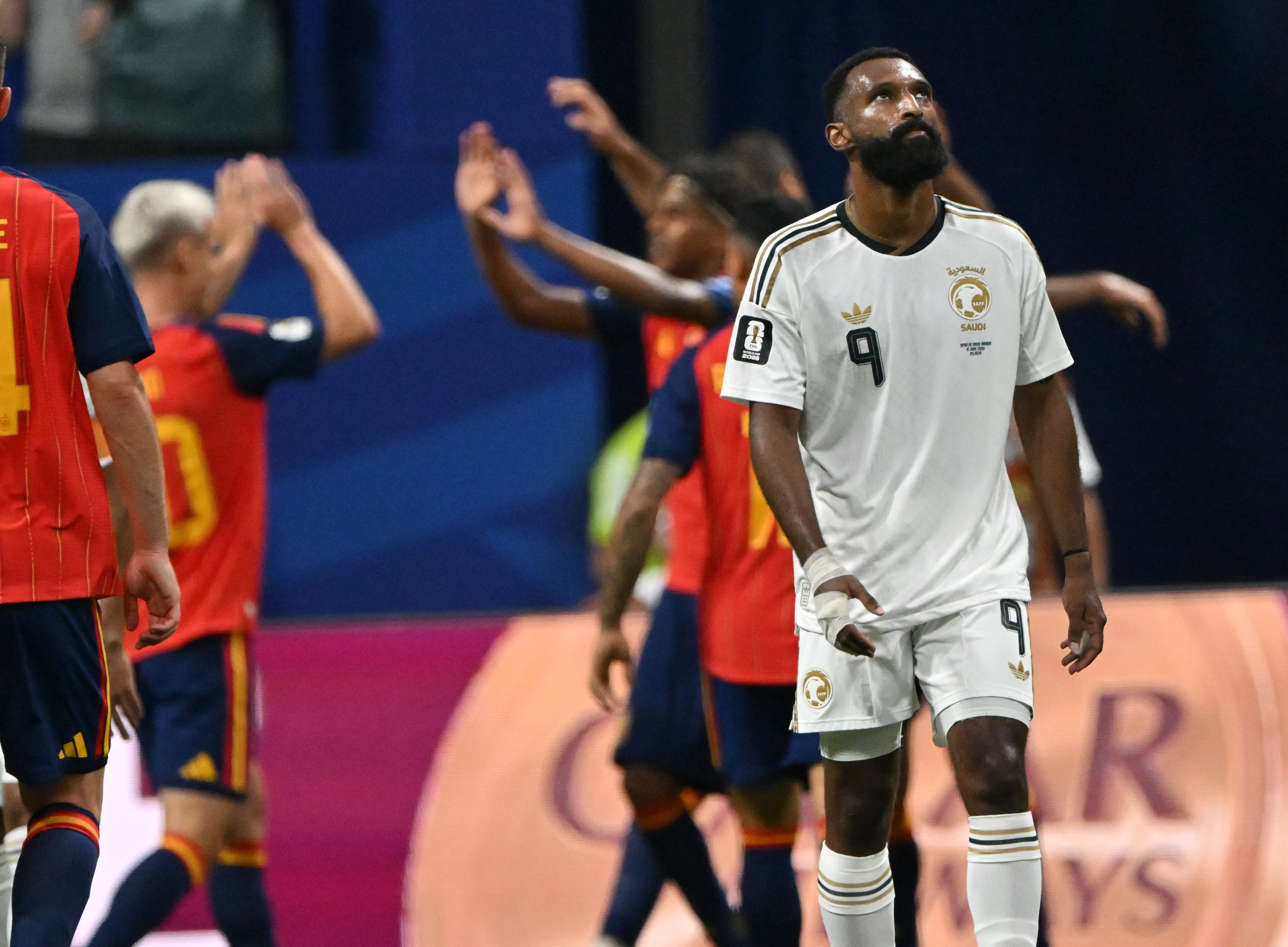Saudi Arabia's Feras Al-Brikan looks on as Spain celebrates going ahead 3-0 during the first half of the Spain vs. Saudi Arabia World Cup match Sunday, June 21, 2026, at Atlanta Stadium. (Hyosub Shin/AJC)