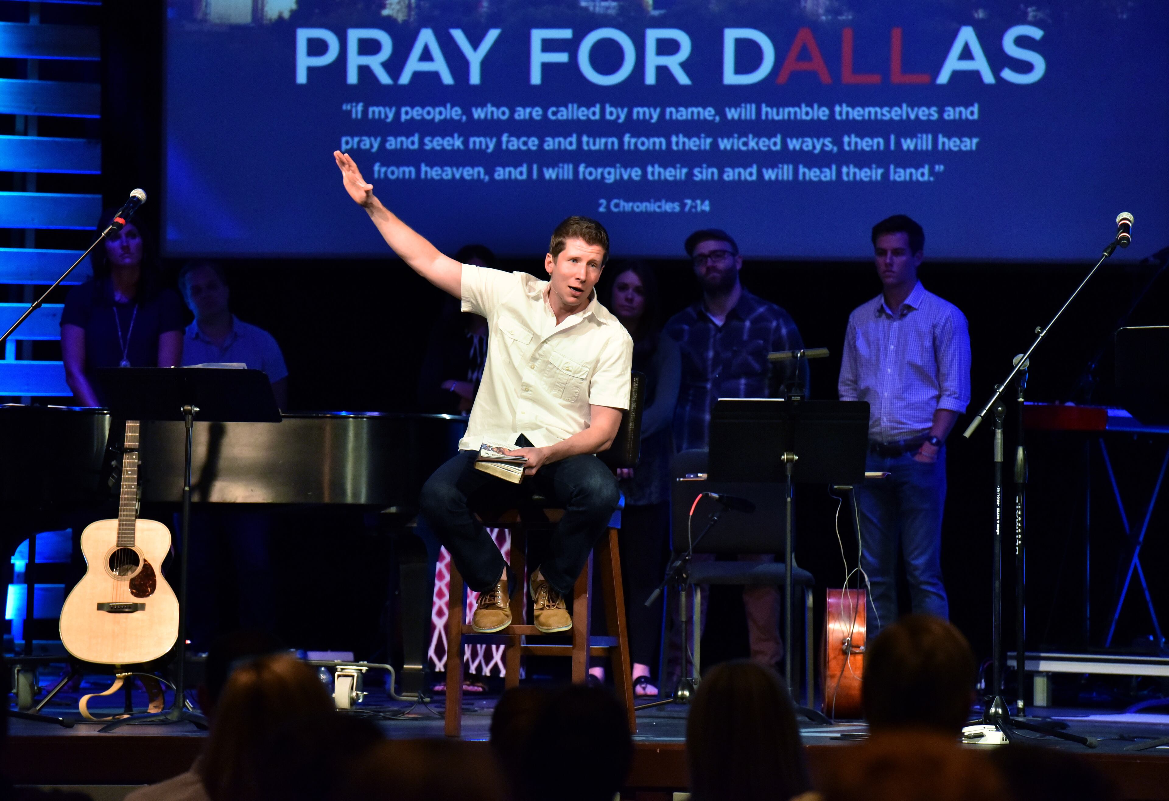 July 10, 2016 Dallas, Texas - Associate Pastor Sam Holm leads their contemporary service at Park Cities Baptist Church in Dallas on Sunday, July 10, 2016. Two prominent pastors in Dallas are leading their flocks, and the entire city, through one of its grimmest chapters. Jeff Warren, who is white, and Bryan Carter, who is black, are renowned for their work espousing racial unity. They once swapped pulpits on Palm Sunday as a way of uniting their congregations and just got back from a joint pilgrimage to Charleston's Emanuel AME. They organized the huge downtown prayer service on Thursday and will no doubt speak on the topic from their respective pulpits on Sunday. HYOSUB SHIN / HSHIN@AJC.COM