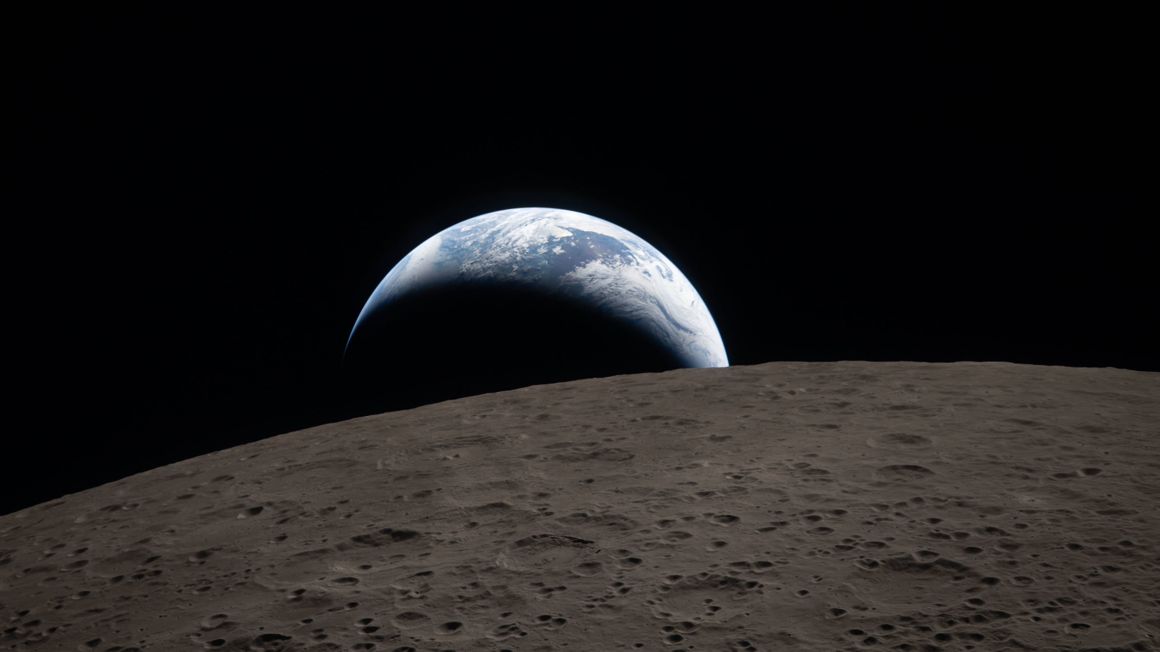 In this image provided by NASA, The Artemis II crew captured this view of an Earthset on Monday, April 6, 2026, as they flew around the Moon. (NASA via AP)