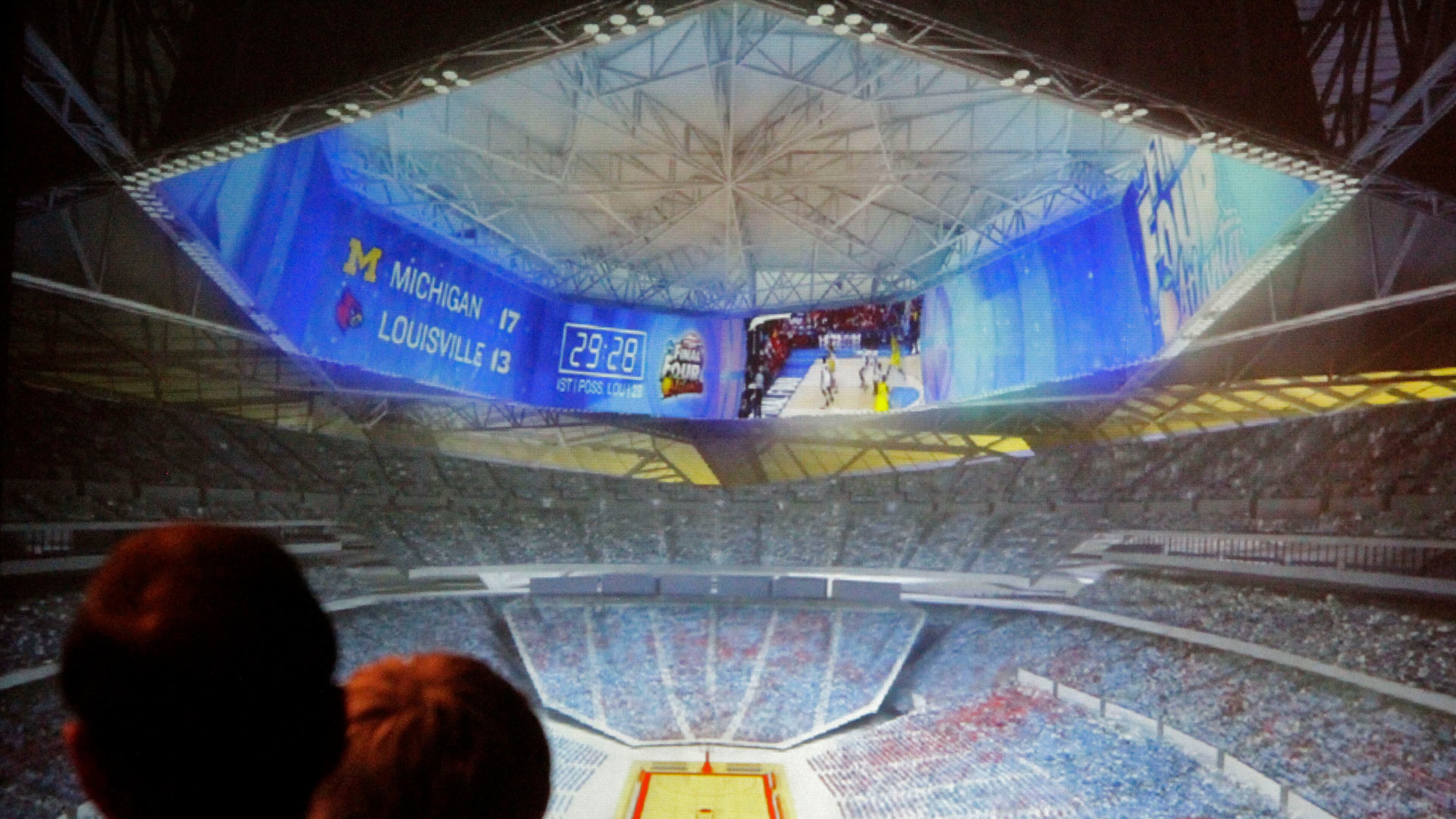 Members of the Georgia World Congress Center Authority board view a rendering of a prototype stadium design that includes a 360-degree video screen. The board approved a contract Tuesday with Kansas City-based 360 Architecture to design the new Falcons stadium.