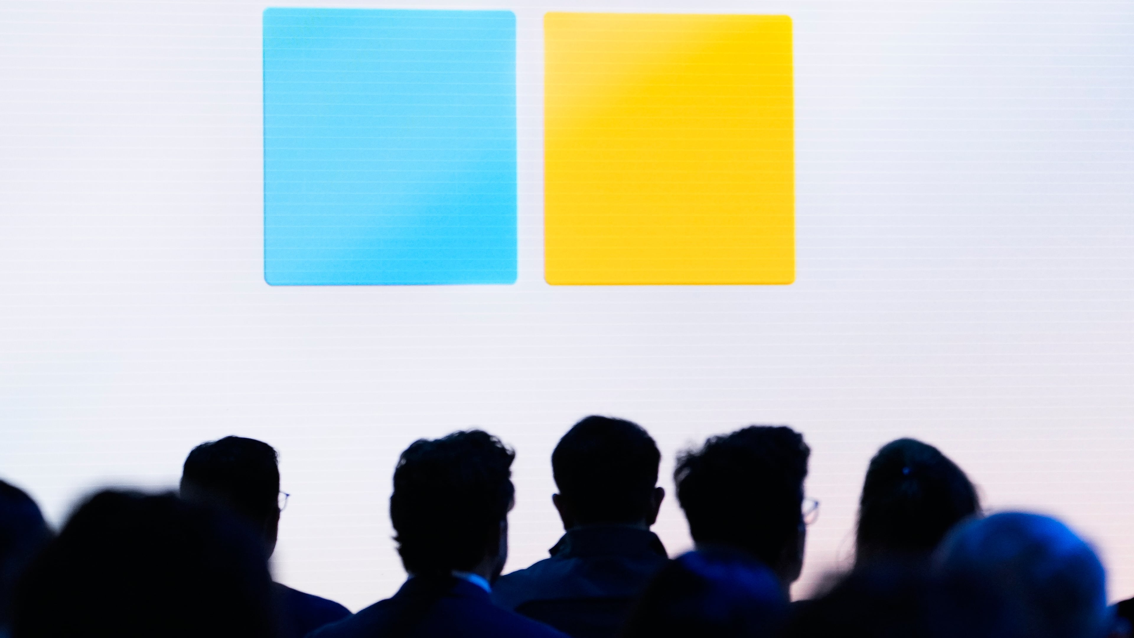 FILE - People attend a showcase event of the company's AI assistant, Copilot, ahead of the annual Build developer conference at Microsoft headquarters, Monday, May 20, 2024, in Redmond, Wash. (AP Photo/Lindsey Wasson, File)