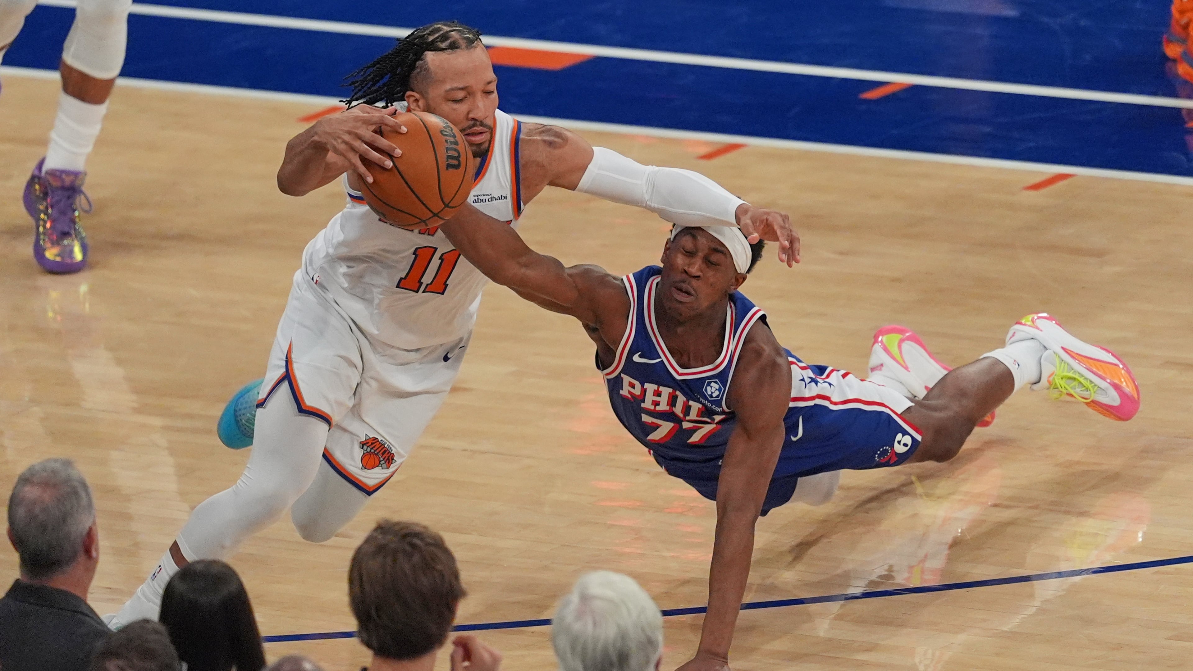 Philadelphia 76ers' Vj Edgecombe, right, fouls New York Knicks' Jalen Brunson during the first half of Game 1 in a second-round NBA basketball playoffs series Monday, May 4, 2026, in New York. (AP Photo/Seth Wenig)