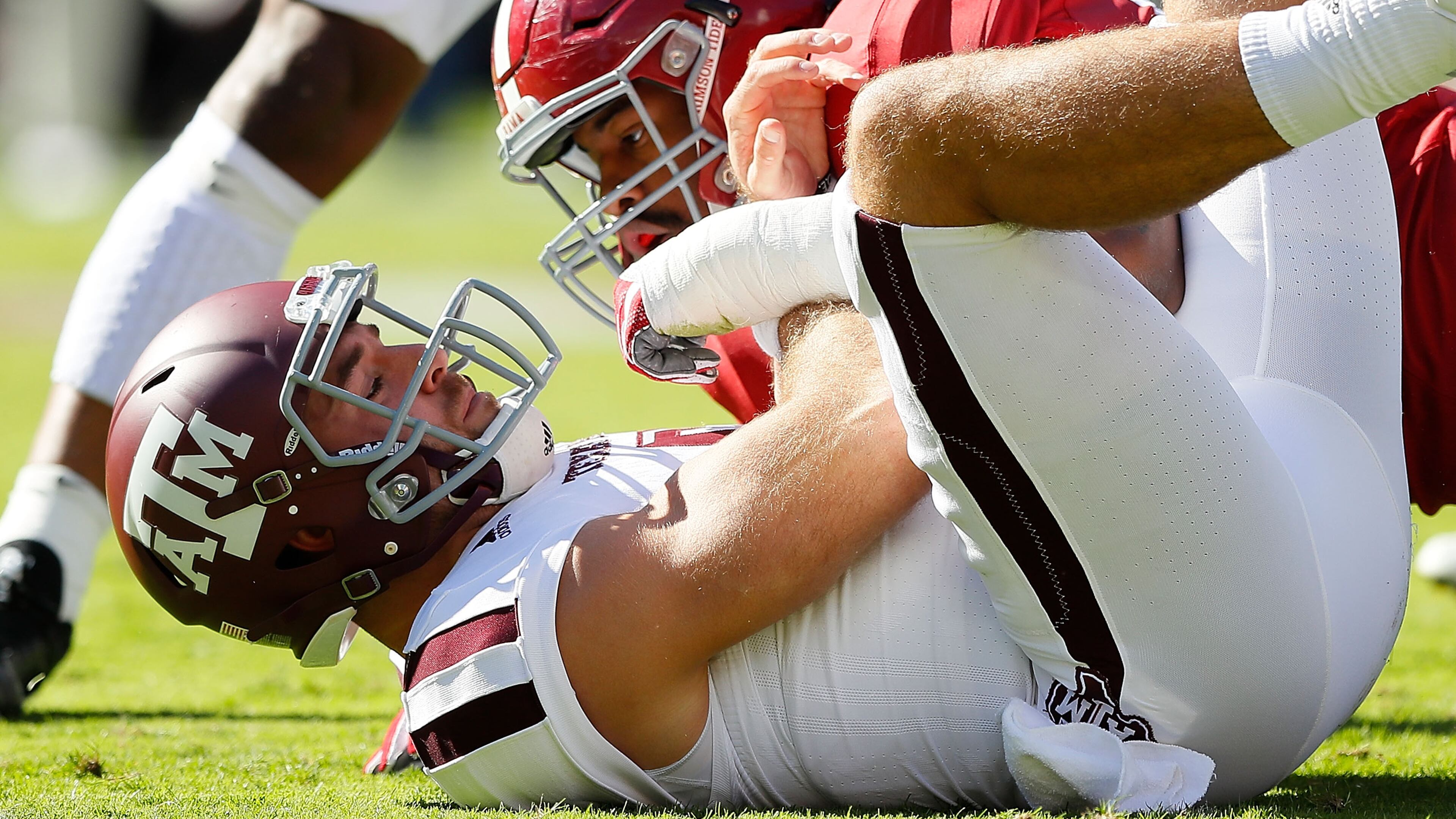 Alabama's Jonathan Allen, here introducing himself to Texas A&M's Trevor Knight, leads a fearsome defense to the SEC Championship game. (Kevin C. Cox/Getty Images)