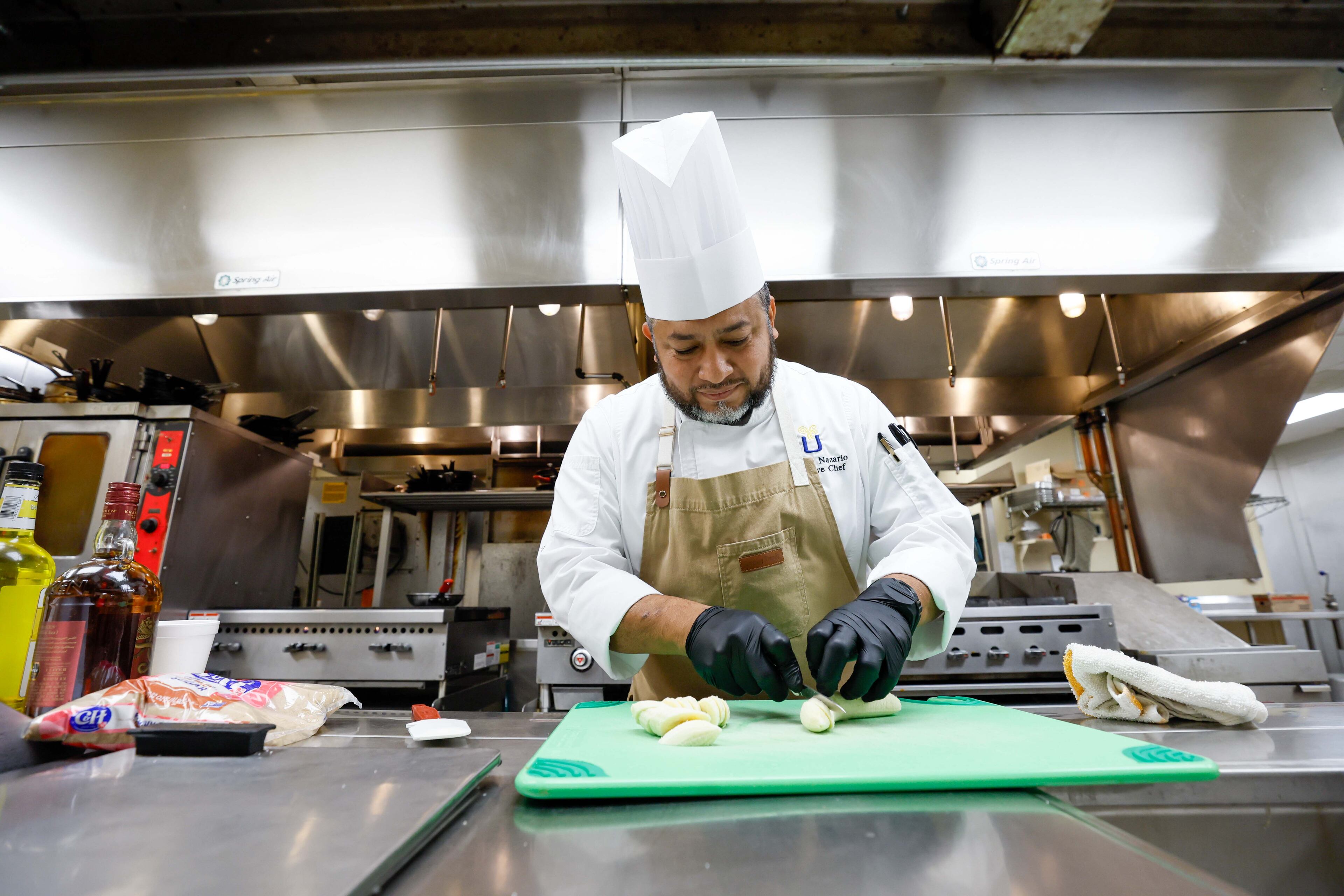 Chef Antonio Nazario prepares a banana dish at Lenbrook retirement community.
(Miguel Martinez / AJC)