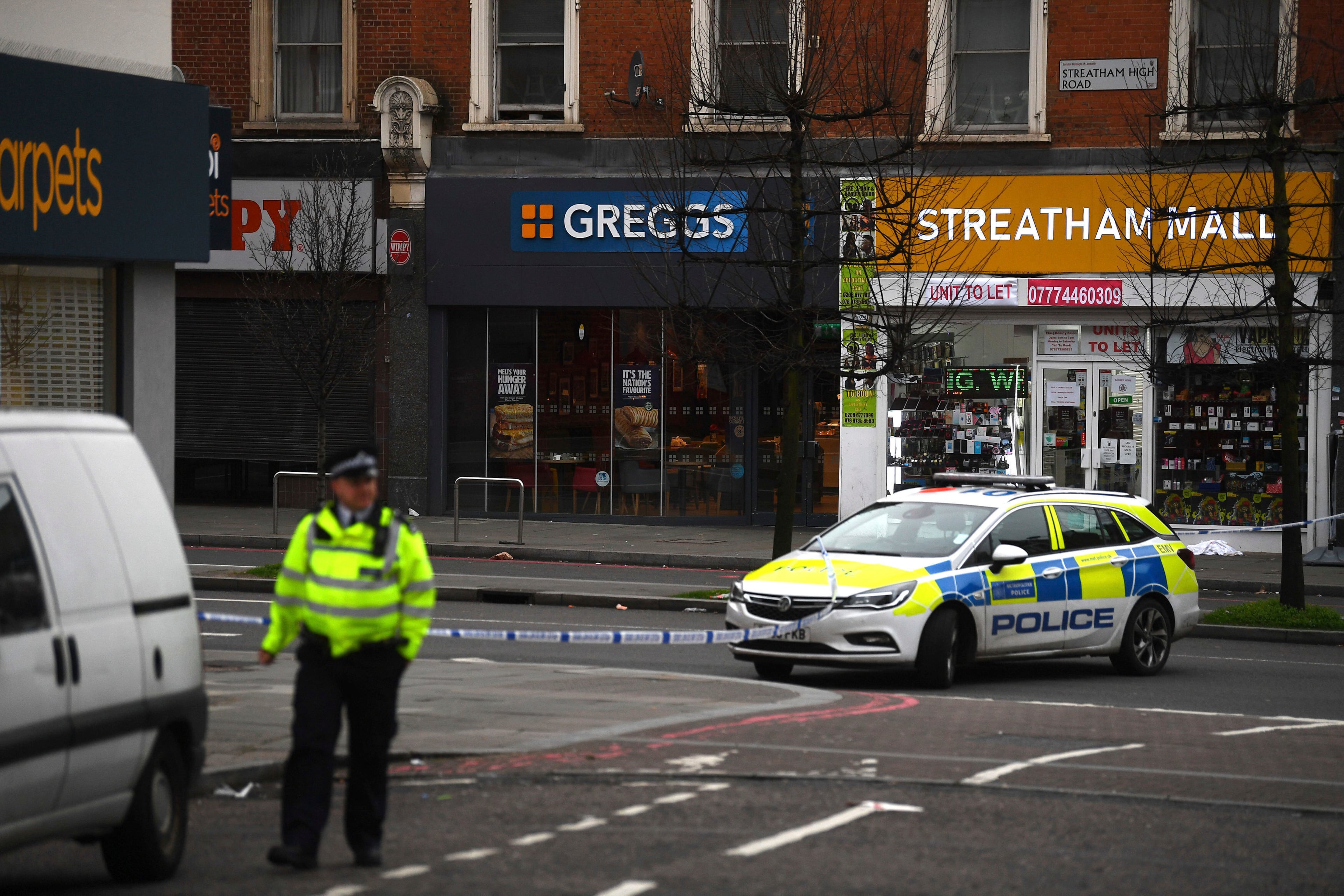 Police attend the scene after an incident in Streatham, London, Sunday Feb. 2, 2020. London police say officers shot a man during a âterrorism-related incidentâ that involved the stabbings of âa number of people.â (Victoria Jones/PA via AP)