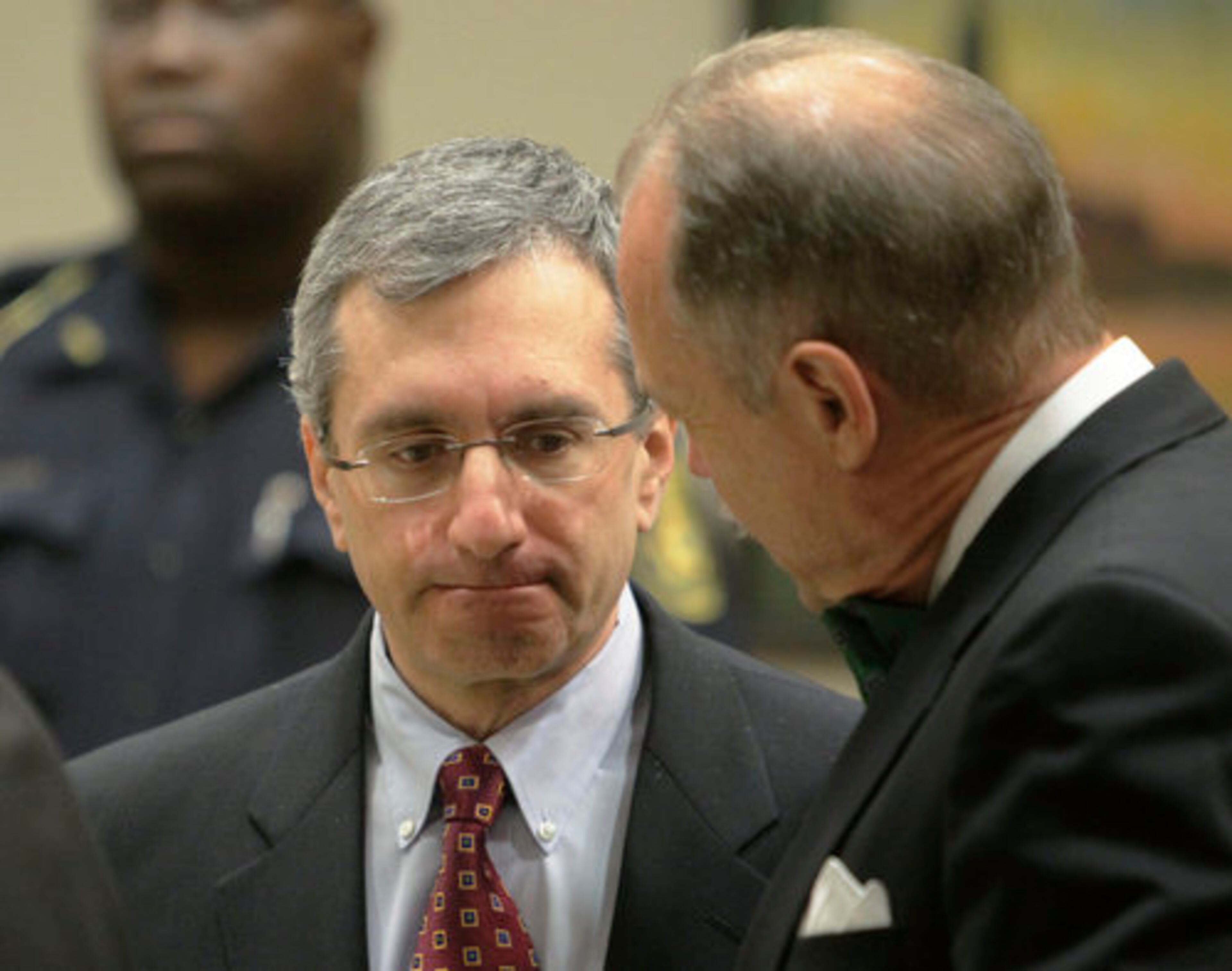 DACYCARE MURDER SUSPECT--Defendant Hemy Neuman talks with Douglas N. Peters, one of his attorneys, during a court break Monday, Aug, 15, 2011. Don and Steve Sneiderman, father and brother of murder victim Rusty Snederman, and family friends Josh and Leah Golub, attended today's motions hearing for Hemy Neuman, who is accused of killing him last November.