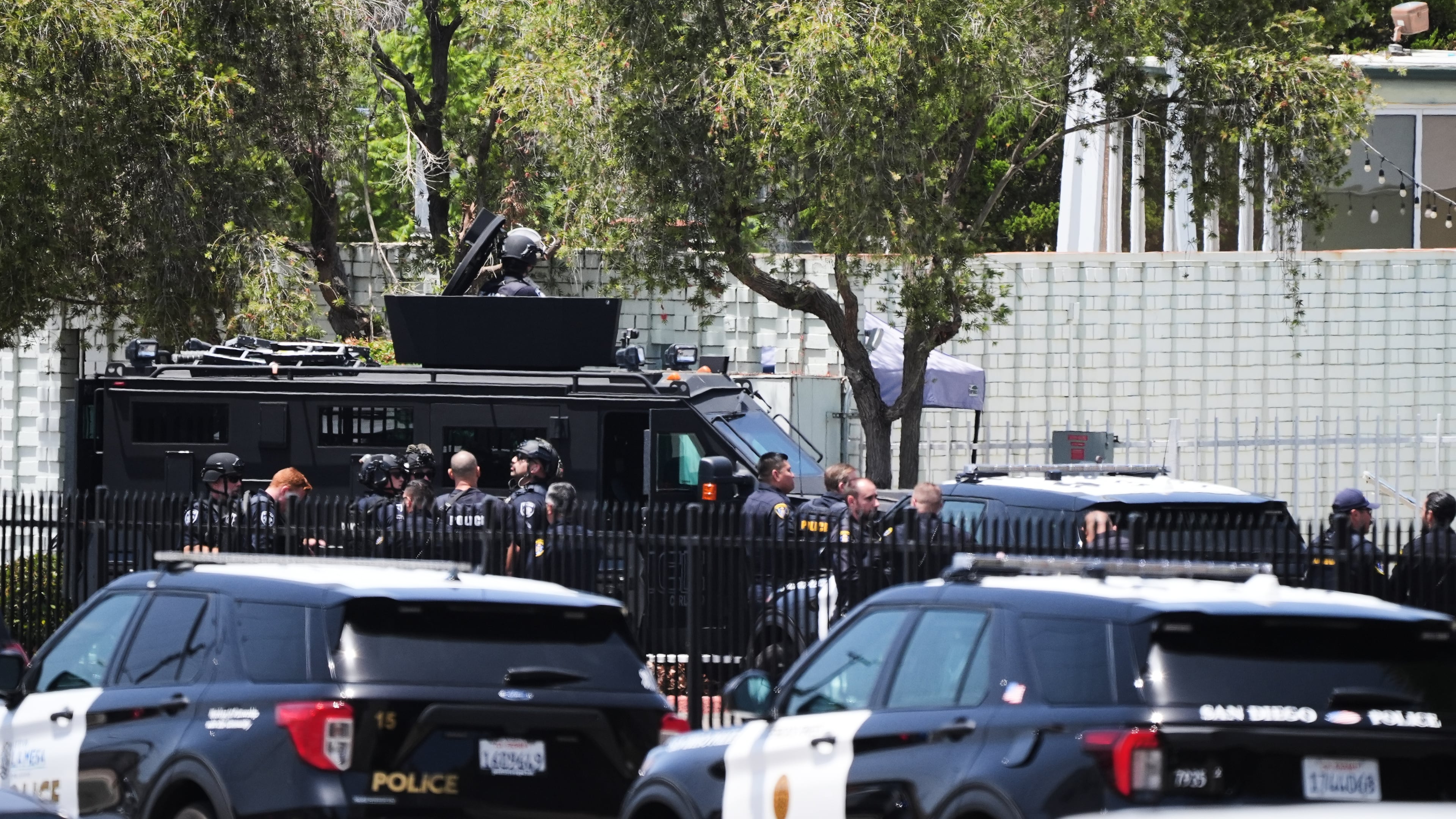 Police stage at the scene of a shooting outside the Islamic Center of San Diego Monday, May 18, 2026, in San Diego. (AP Photo/Gregory Bull)