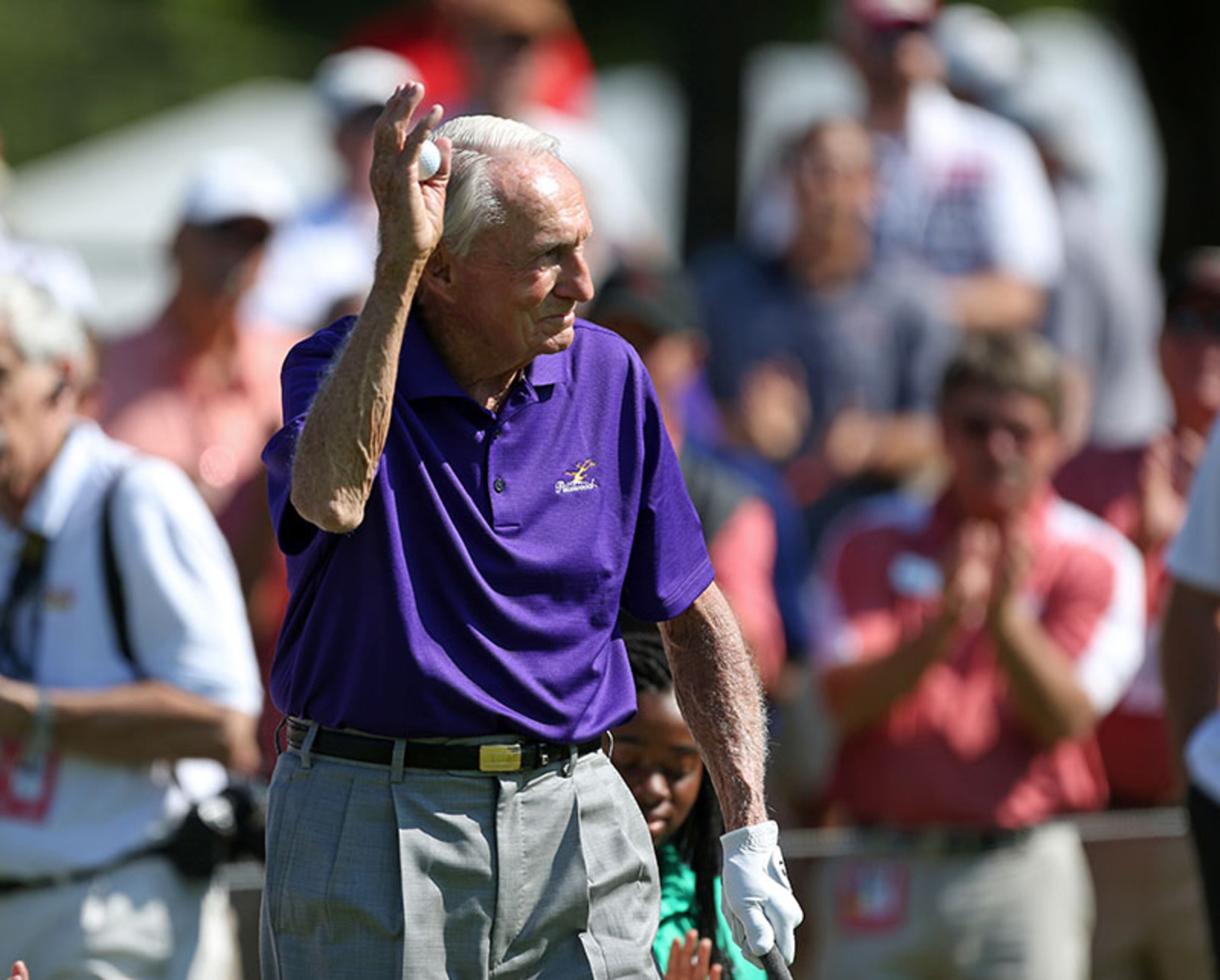 The 1958 PGA Championship winner Dow Finsterwald waves to the crowd before he hits off of the first tee during the opening ceremony of the 2013 Tour Championship at East Lake Golf Club Thursday in Atlanta.