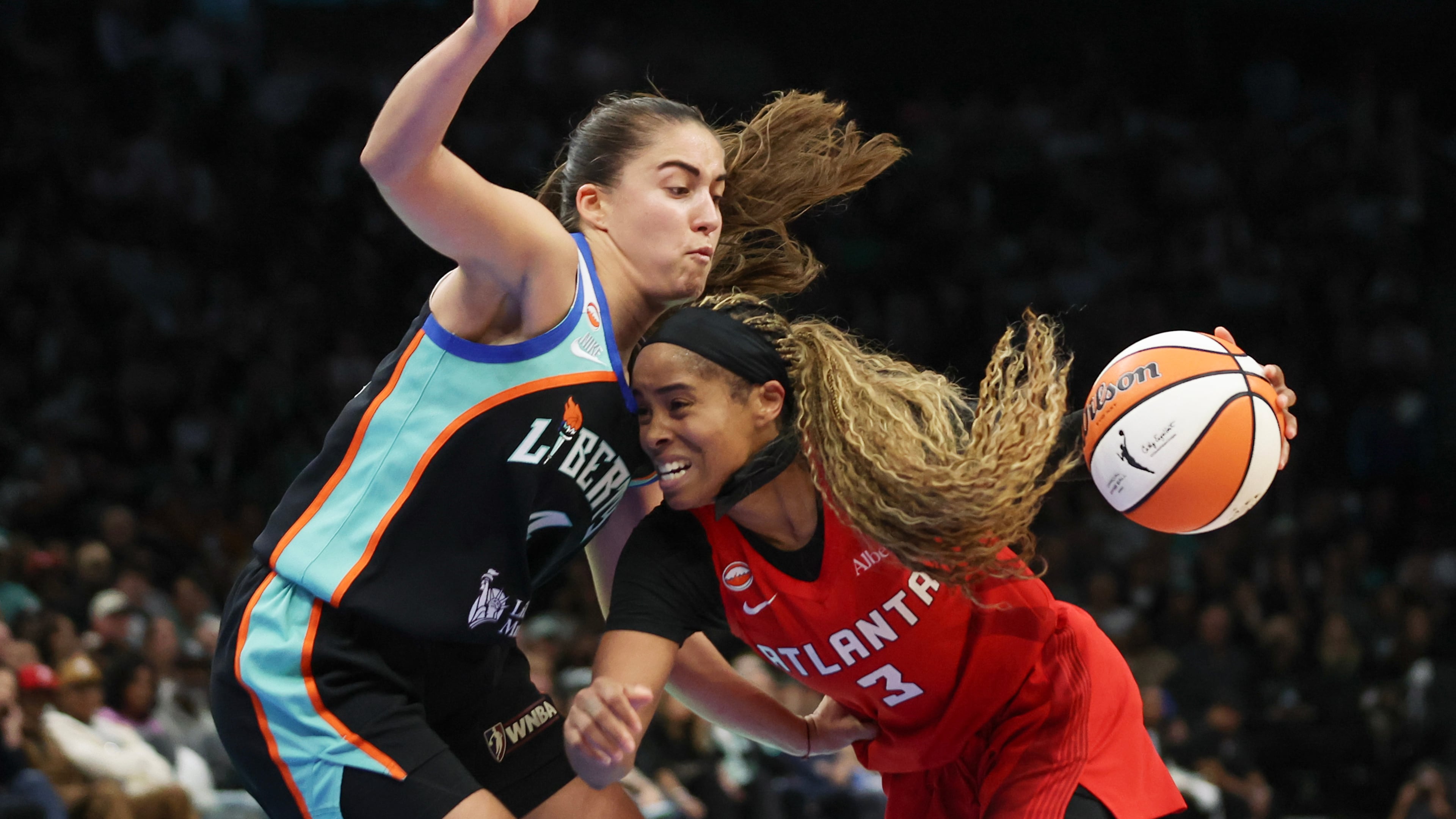 Dream guard Jordin Canada (right) is defended by Liberty guard Marine Fauthoux during the second half of Game 3 of the WNBA semifinals Friday, Oct. 9, 2026, in New York. The Dream beat the Liberty in the series to advance to the WNBA Finals, which begin Saturday. (Heather Khalifa/AP)