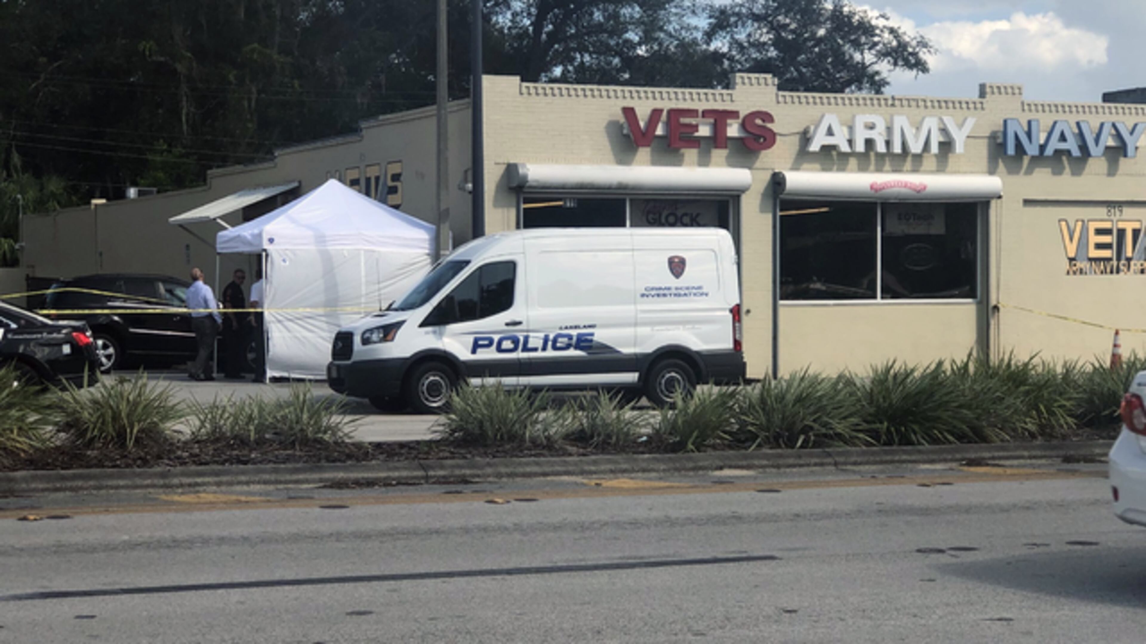 The scene outside the Vets Army Navy Surplus store in Lakeland, Florida, where a city councilman allegedly sot someone at the store Wednesday afternoon.
