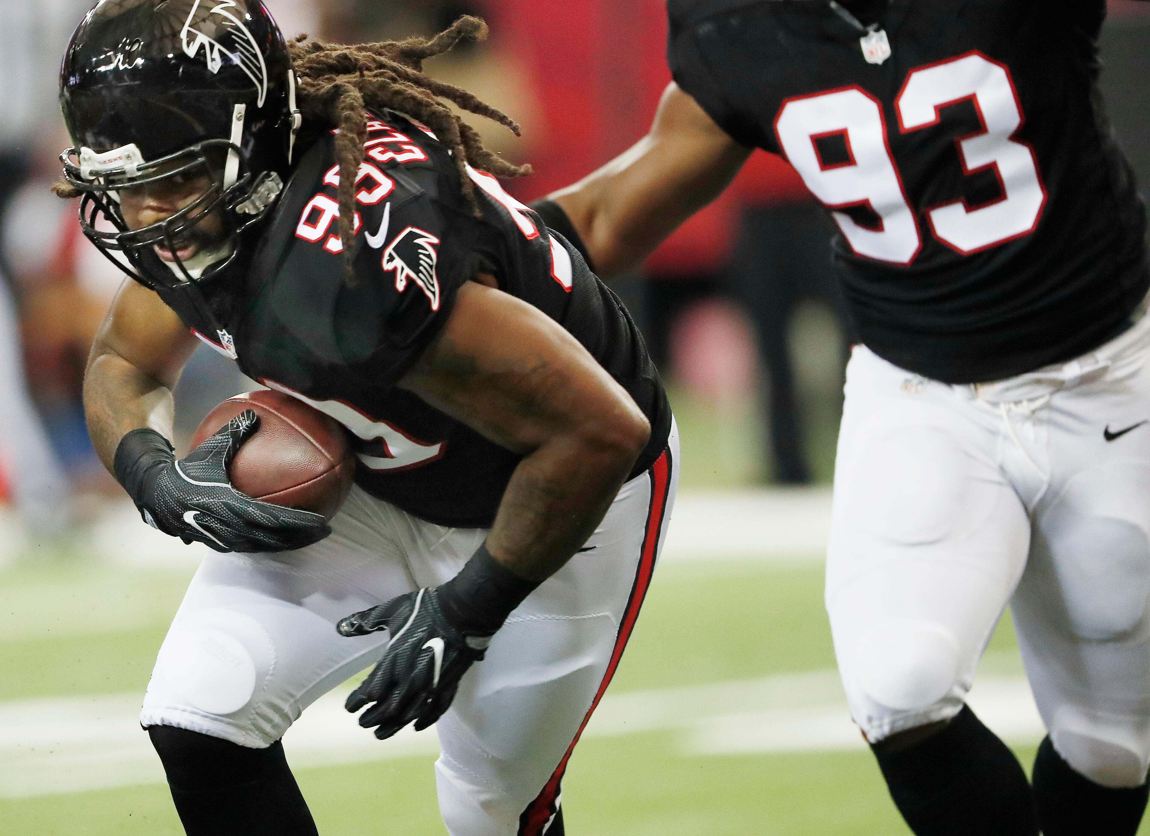 Atlanta Falcons defensive end Adrian Clayborn (99) runs toward the end zone after picking up a fumbled ball against the San Diego Chargers during the first half of an NFL football game, Sunday, Oct. 23, 2016, in Atlanta. (AP Photo/John Bazemore)