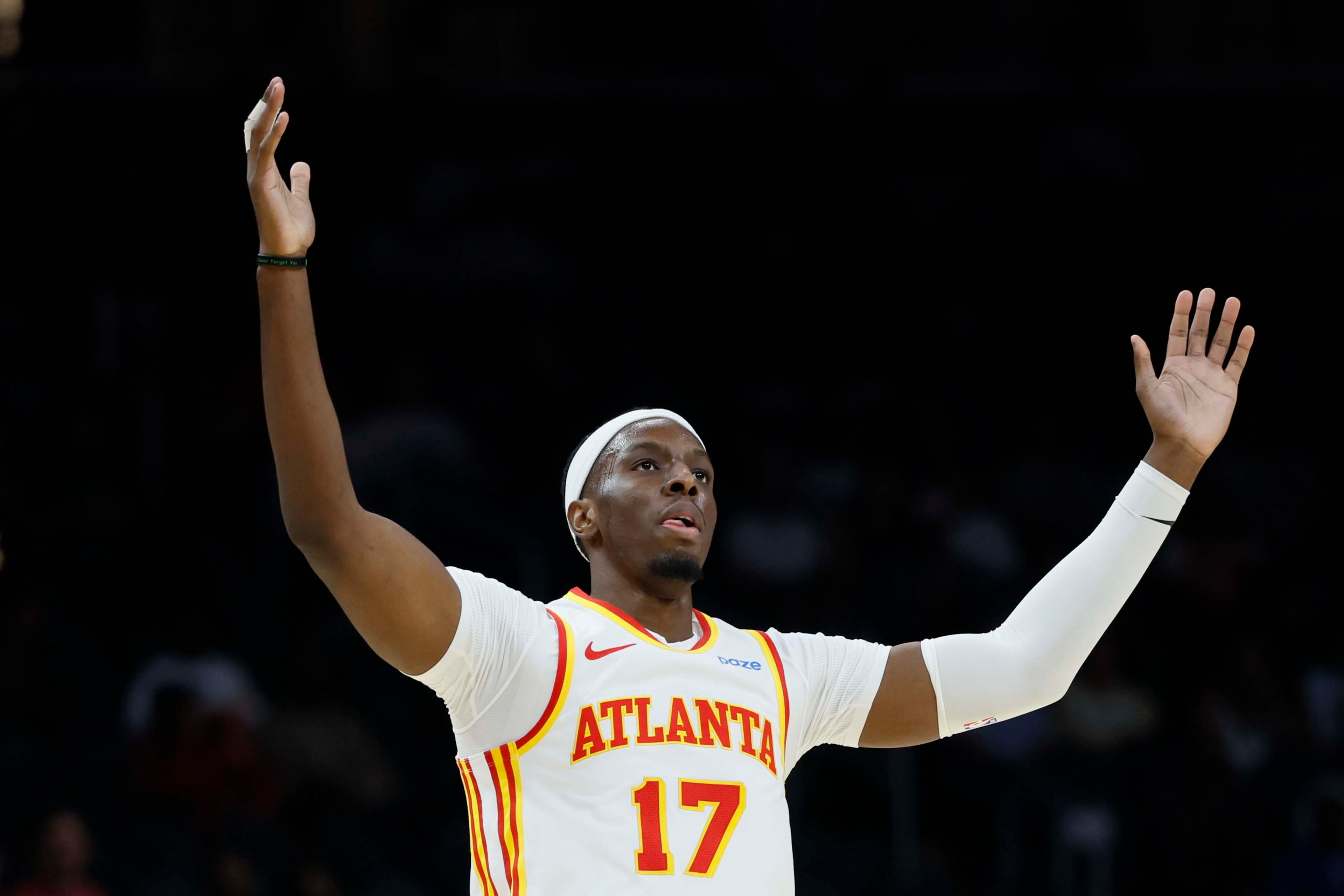 Atlanta Hawks center Onyeka Okongwu reacts after making a 3-pointer during the first half of a preseason NBA basketball game against the Memphis Grizzlies at State Farm Arena in Atlanta on Monday, Oct. 5, 2026. (Miguel Martinez/AJC)
