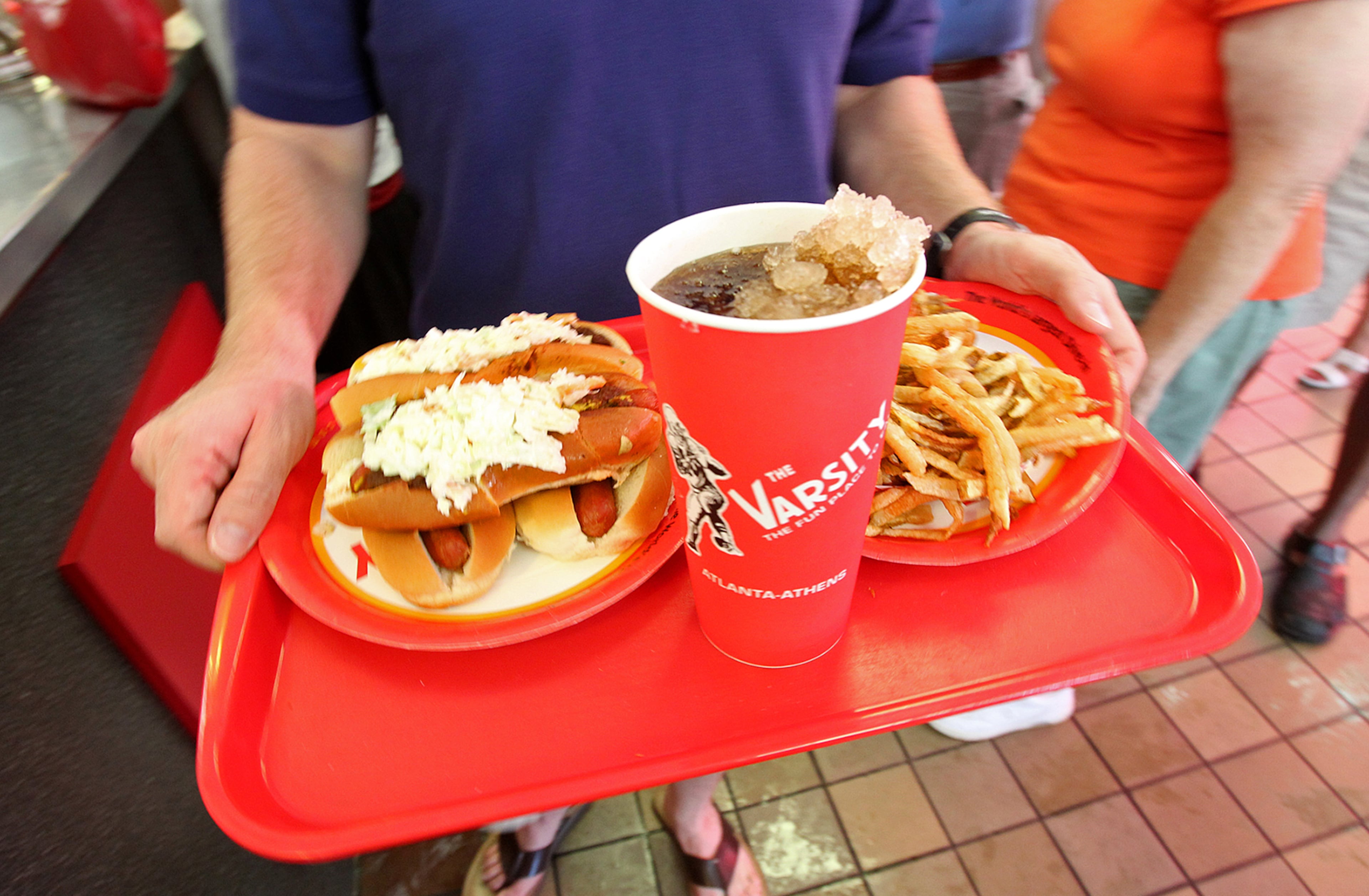 100822 Atlanta - Joshua Sieweke, Decatur, goes with slaw dogs, fries and a coke for his final order at the Varsity Jr. in Atlanta on Sunday, August, 22, 2010. Curtis Compton ccompton@ajc.com