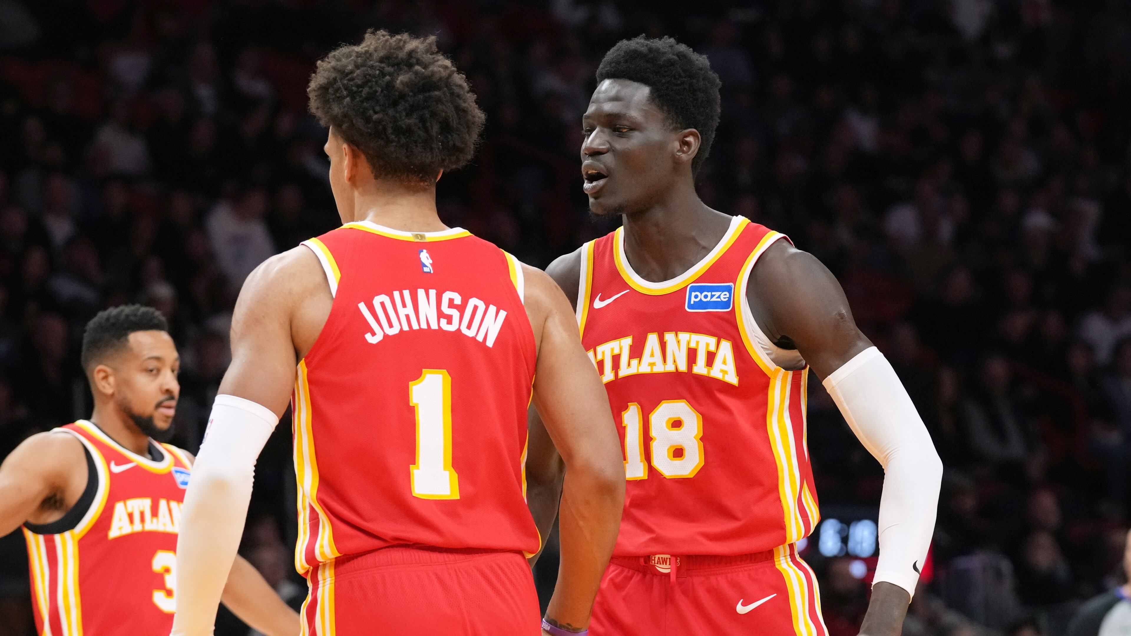Atlanta Hawks forward Jalen Johnson (1) celebrates with Mouhamed Gueye (18) after dunking the ball during the first half of an NBA basketball game against the Miami Heat Tuesday, Feb. 3, 2026, in Miami. (AP Photo/Marta Lavandier)