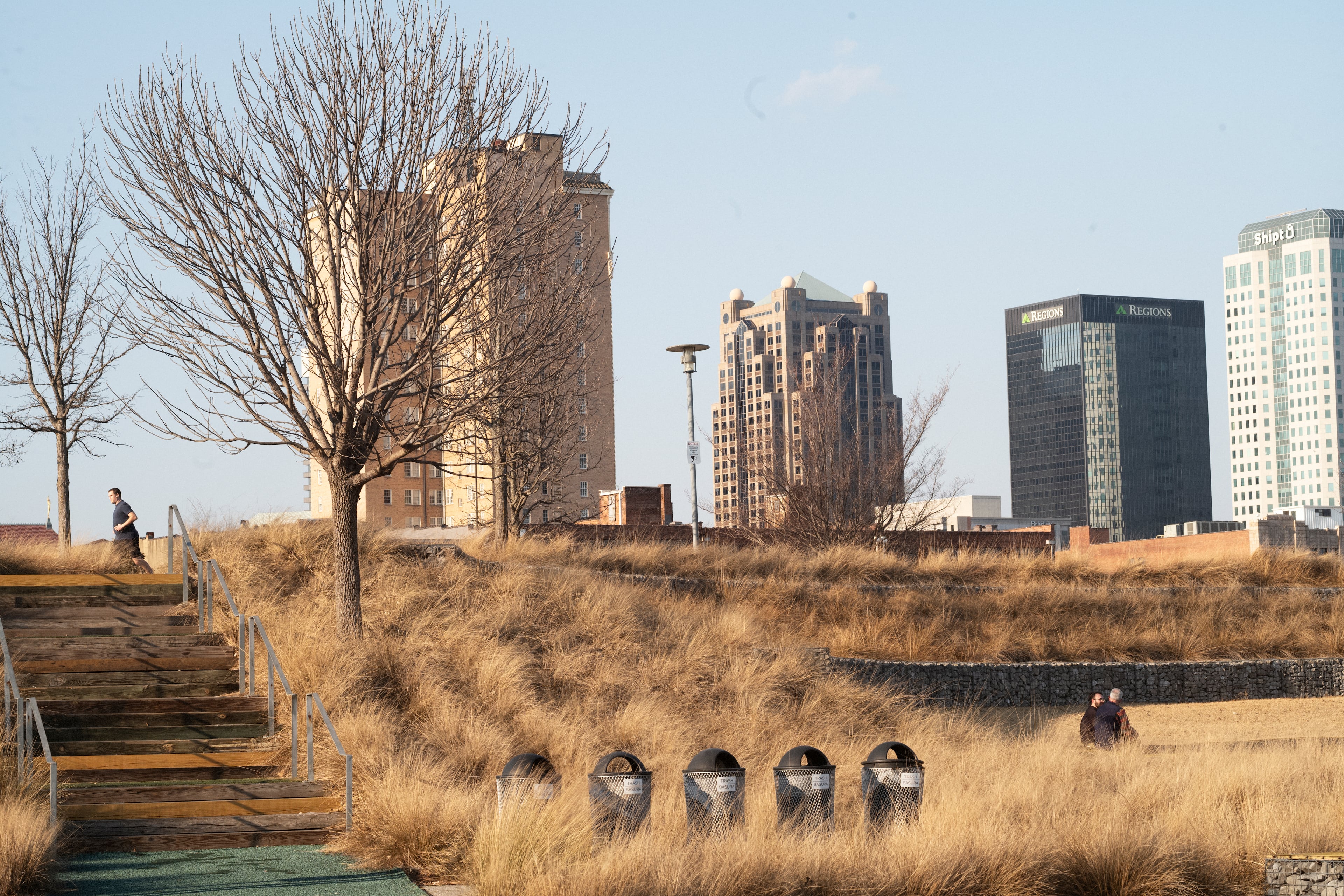 People enjoy a warm winter day at Railroad Park in downtown Birmingham. (Bob Miller for the AJC)