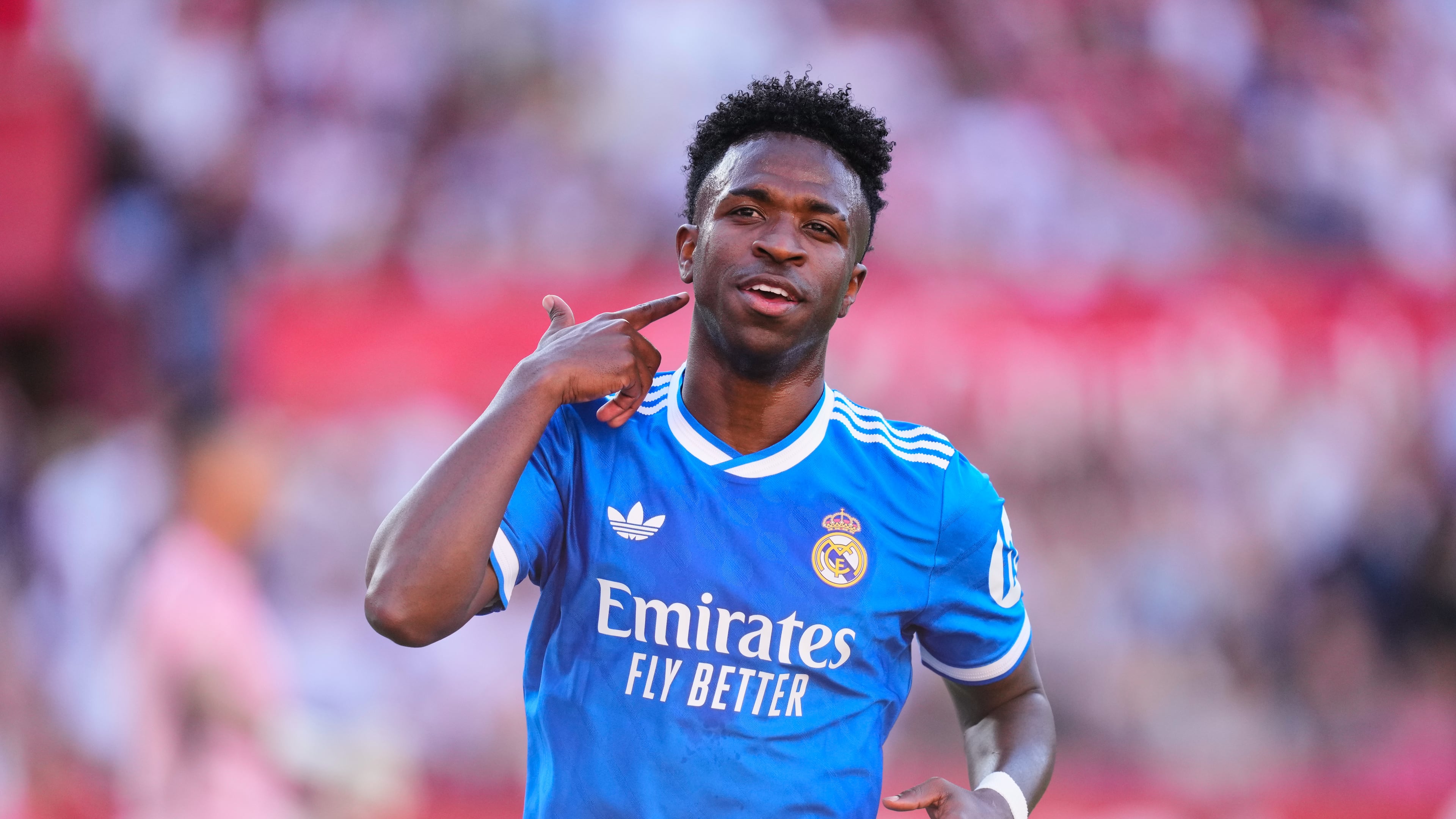 Real Madrid's Vinicius Junior celebrates after scoring the opening goal during the Spanish La Liga soccer match between Real Madrid and Sevilla in Seville, Spain, Sunday, May 17, 2026. (AP Photo/Jose Breton)