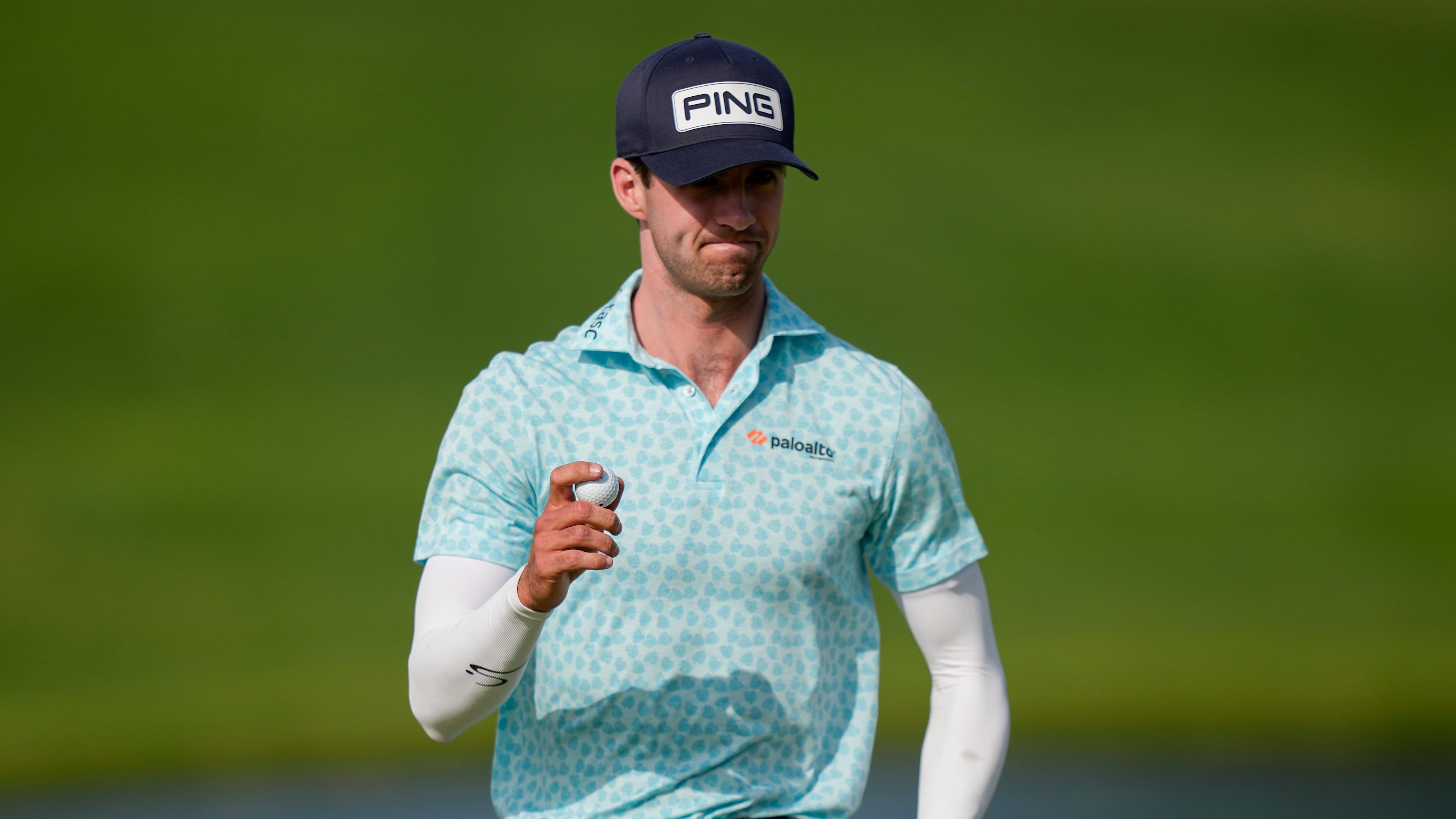 Alex Smalley waves on the 10th green during the third round of the PGA Championship golf tournament at Aronimink Golf Club, Saturday, May 16, 2026, in Newtown Square, PA. (AP Photo/Matt Slocum)