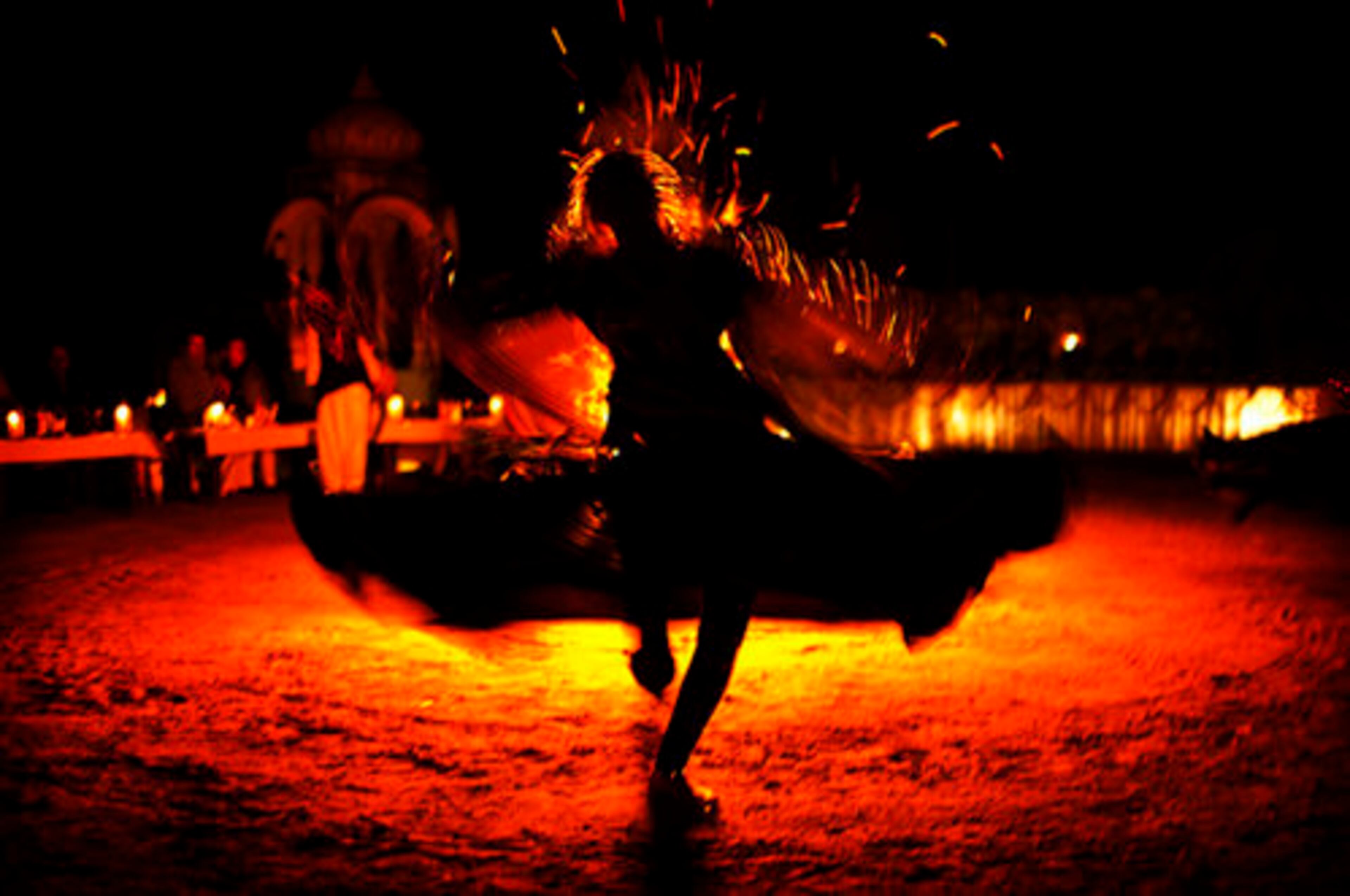 An Indian woman in traditional dress dances during festivities to welcome the new year in the village of Narlai, Rajahstan, India.