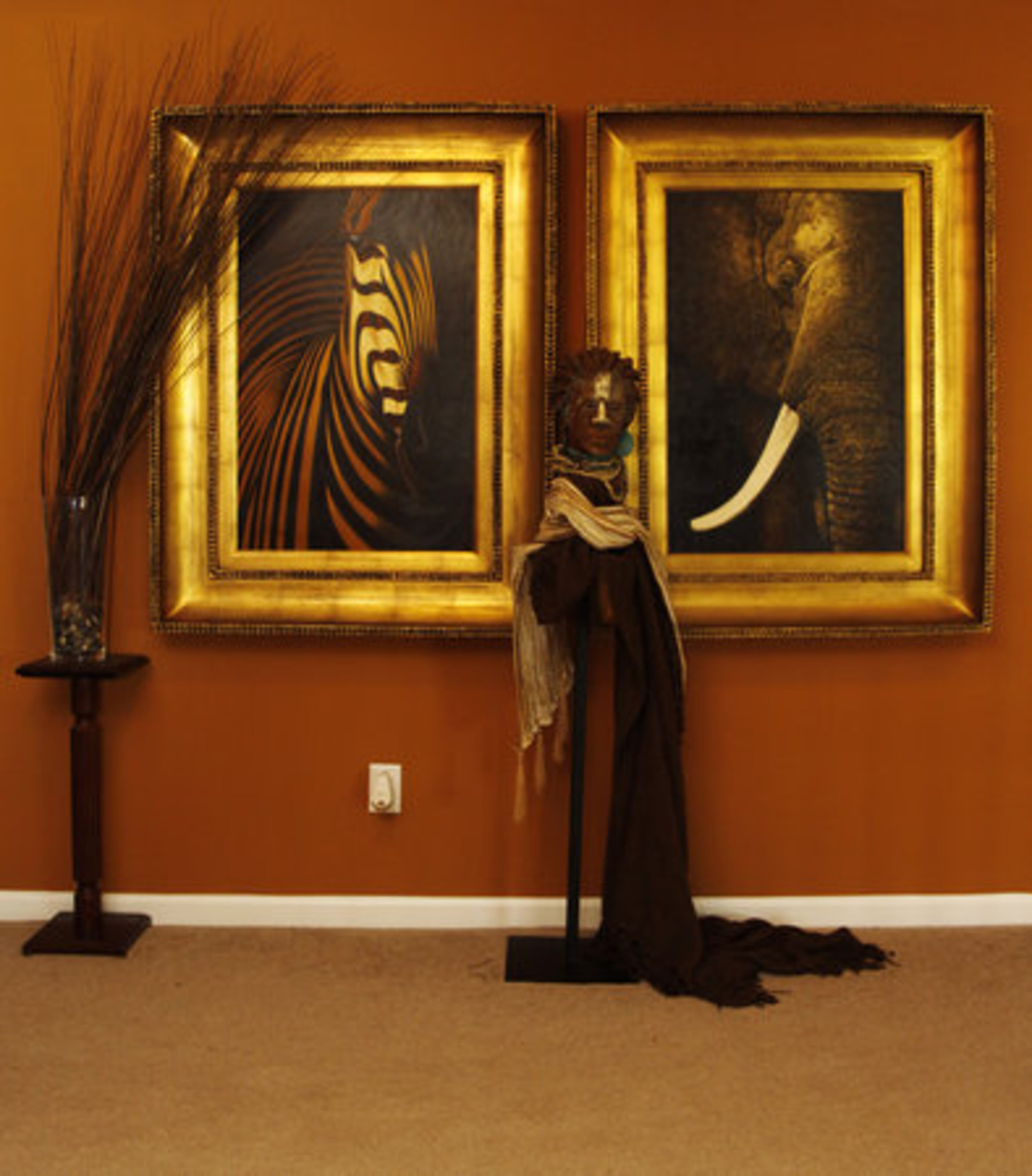 Depictions of African wildlife and beauty, and African-American culture grace most every wall and nook in David DeCuir's airy 4,000-square-foot home. This installation is enriched by an original sculpture by Woodrow Nash who is among the distinguished talents who exhibit in the International Marketplace at the National Black Arts Festival in Atlanta this month.