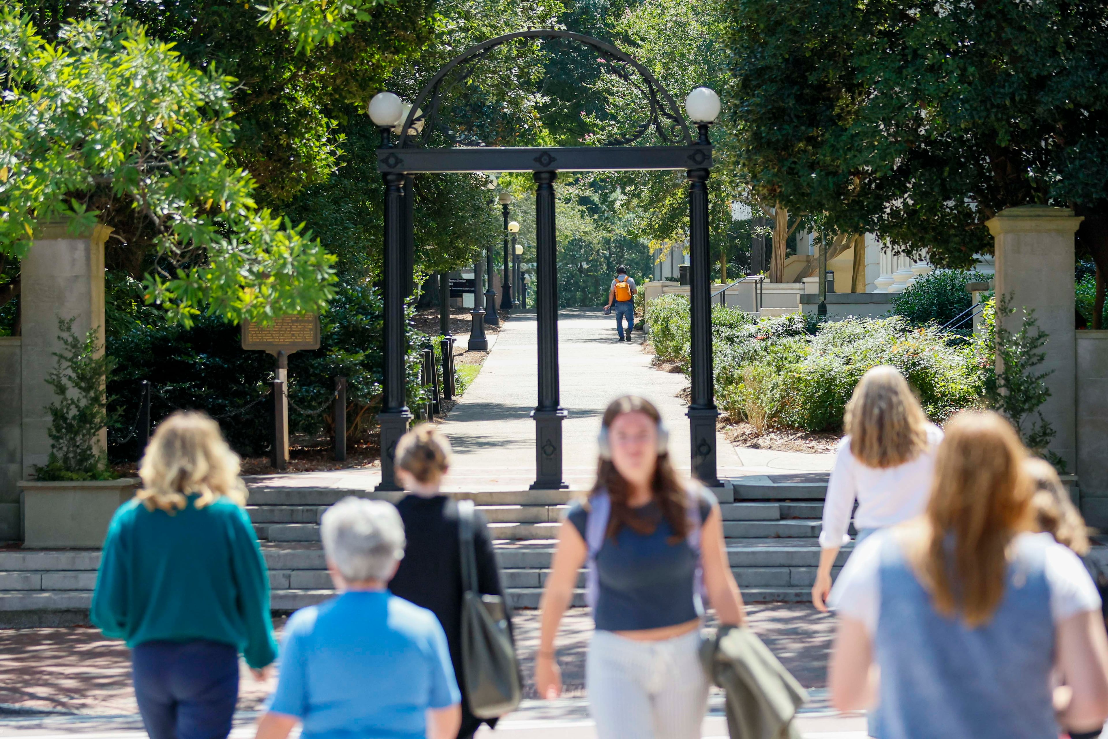 Students walk through the University of Georgia campus. (Miguel Martinez/AJC 2025)