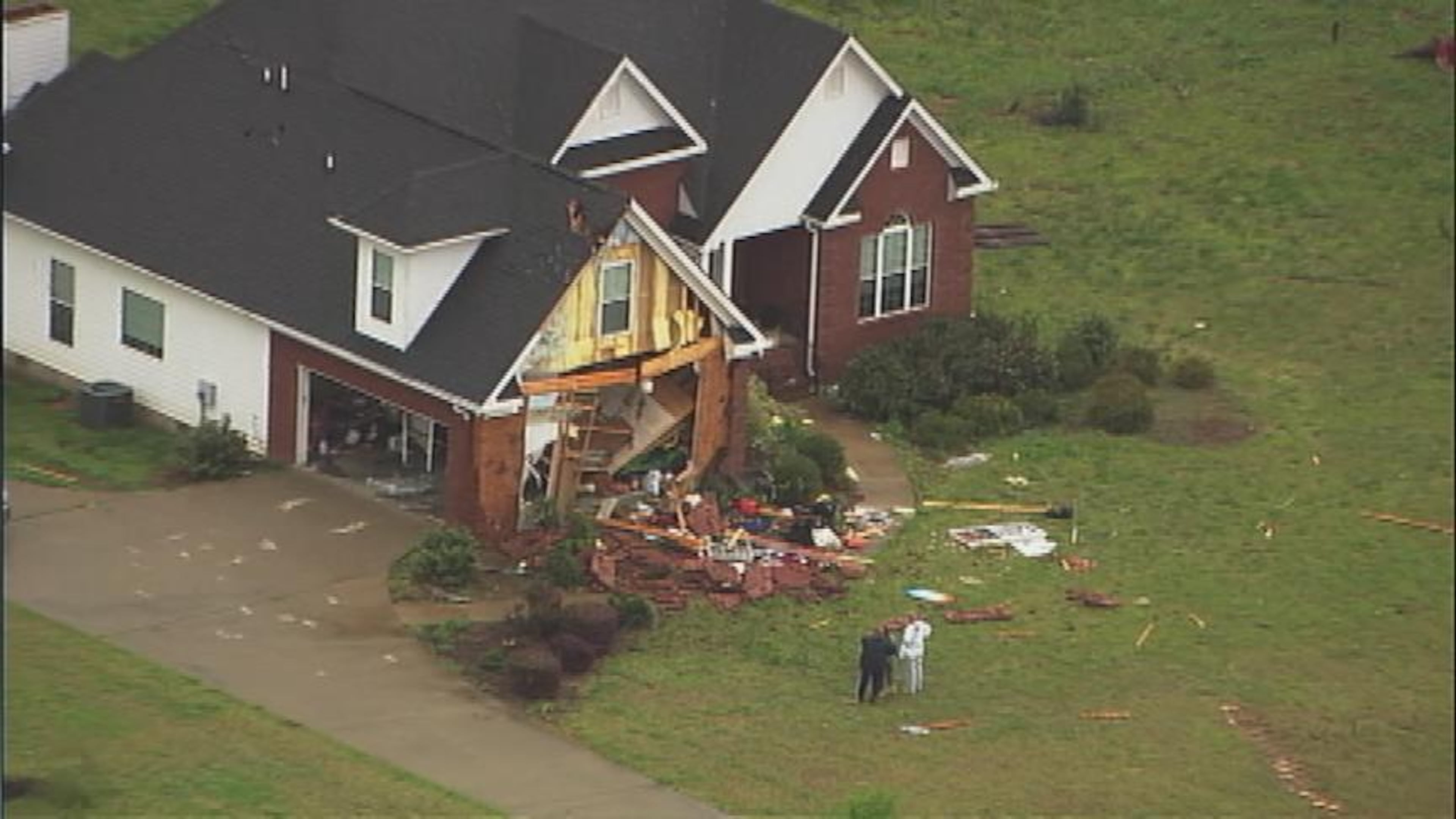 The quick-moving storm toppled trees, scattered debris and damaged homes shortly after 1 p.m.