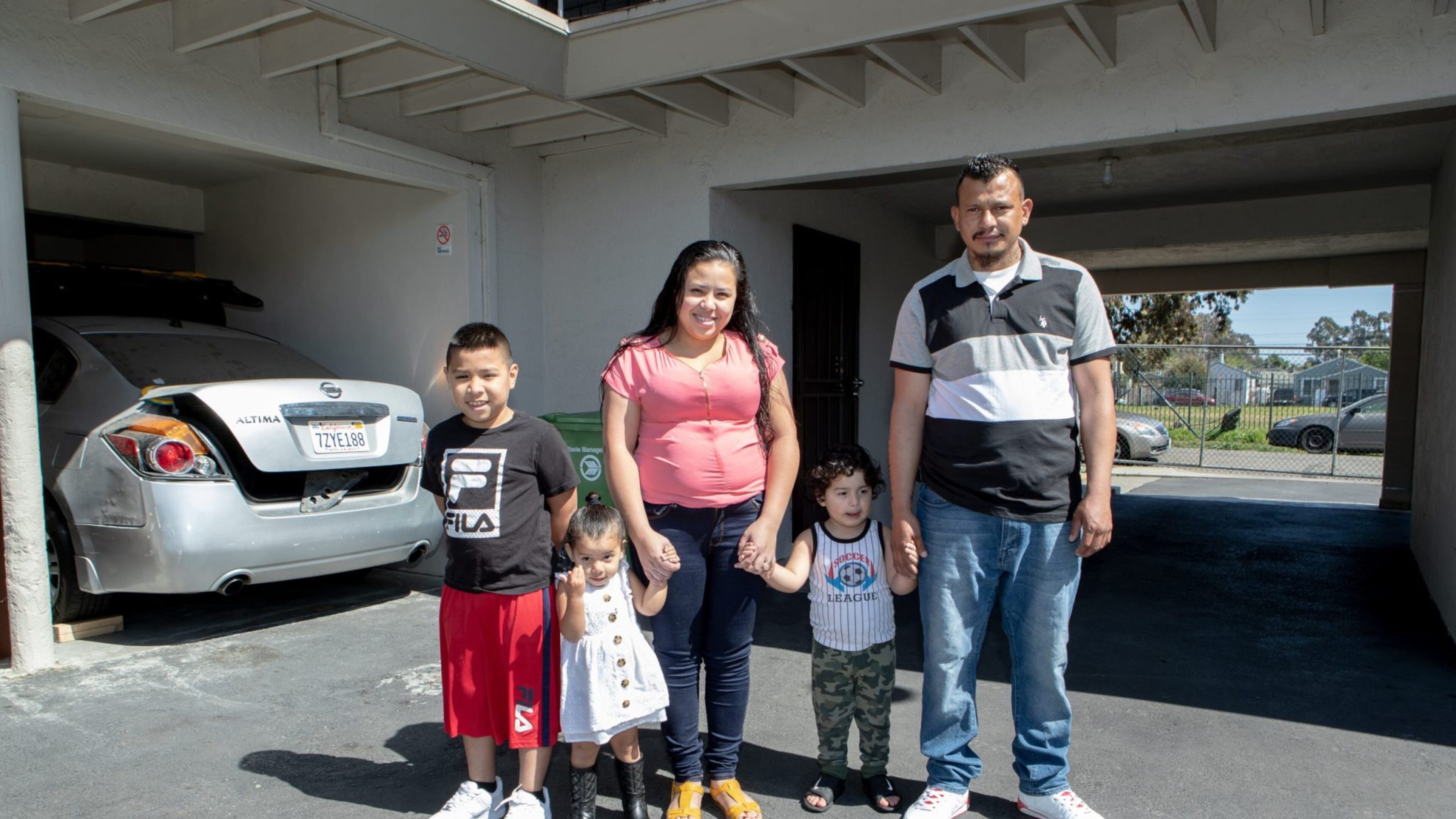 Mirian Obando Rojas with her son Franklin (far left) who attends Bridges Academy at Melrose, her 2-year-old twins, and husband. Credit: Amir Aziz