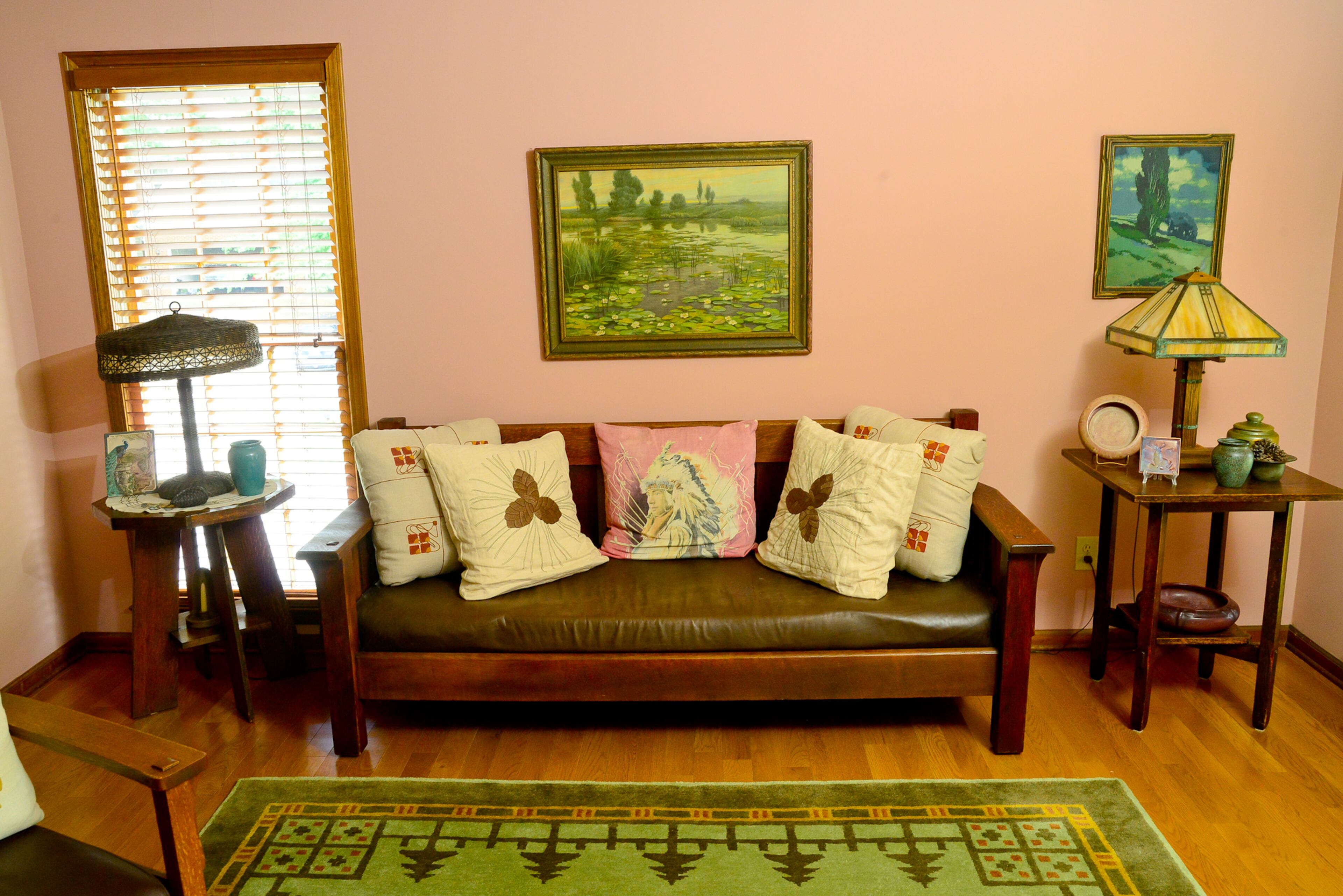 The lamps, with their art glass and mica shades, wall colors and paintings all were selected by the couple in their effort to showcase mission furniture and plein air western landscapes.