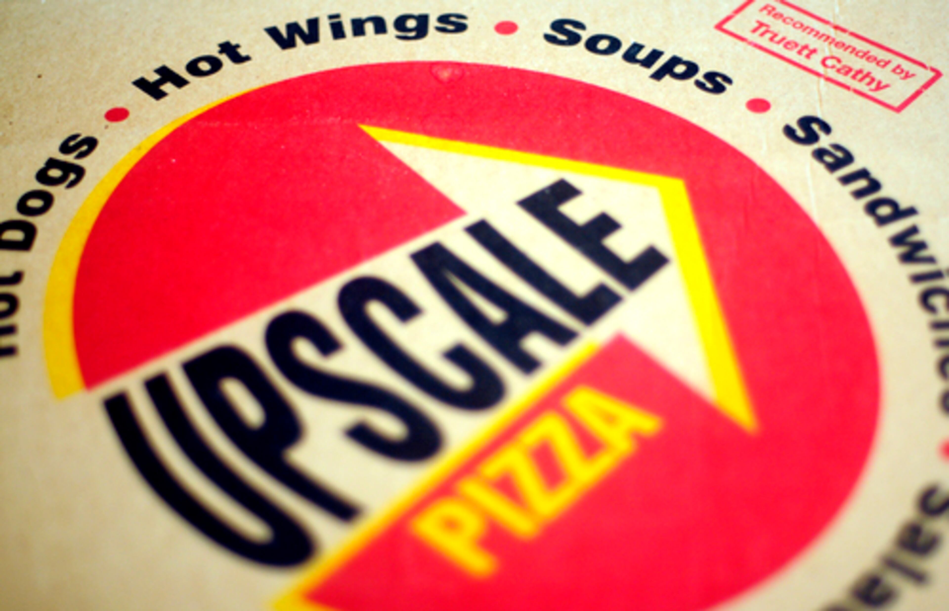 After building a chain of more than 1,300 Chick-fil-A restaurants, Truett Cathy, 87, is opening a new pizza restaurant in Fayetteville, Ga. This is what the pizza boxes will look like. He is calling his newest venture Upscale Pizza and hopes to cater to families. The grand opening is on May 1, 2008.