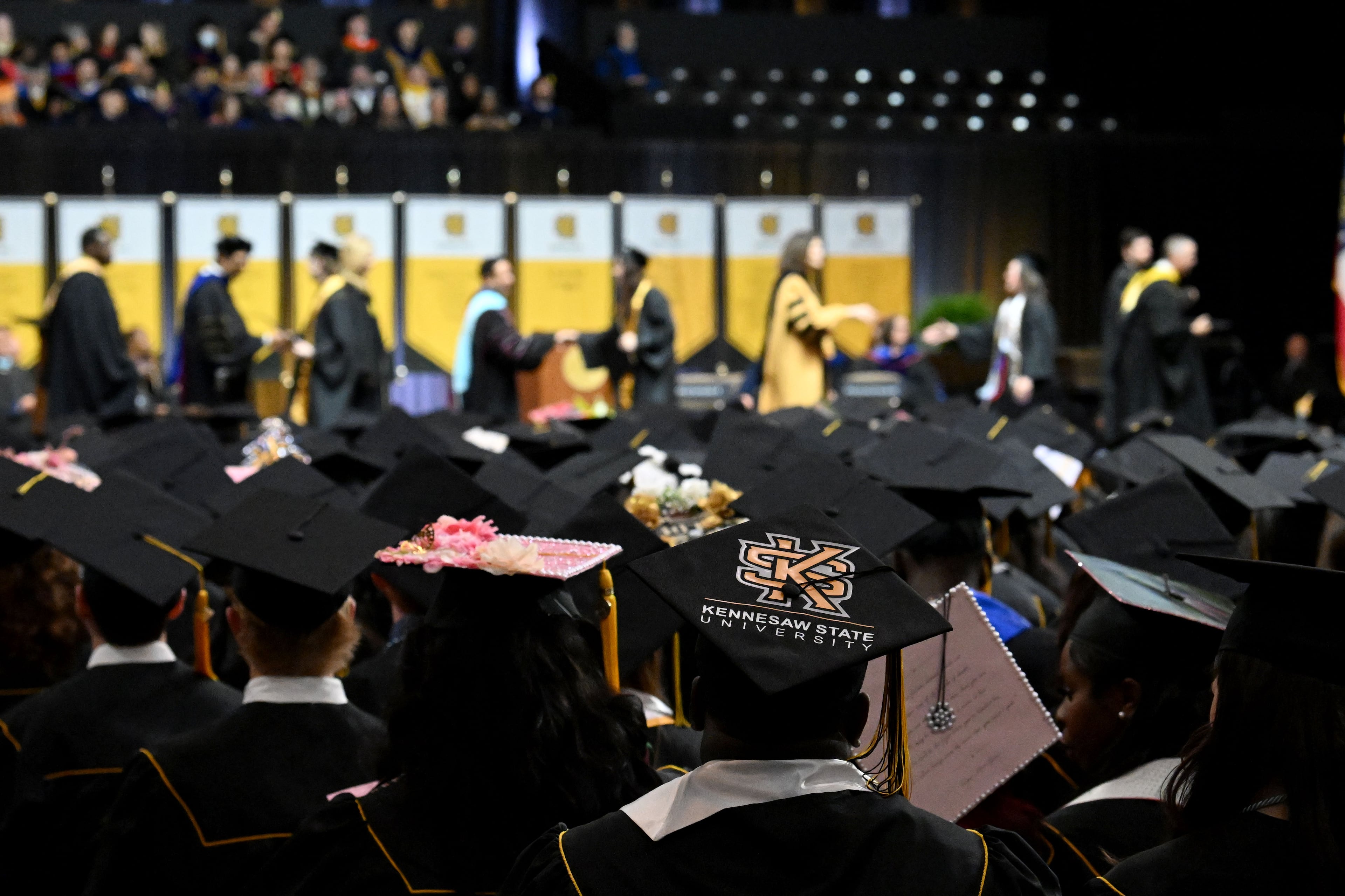 Decorated mortarboards could be seen throughout the graduating class. (Hyosub Shin/AJC)