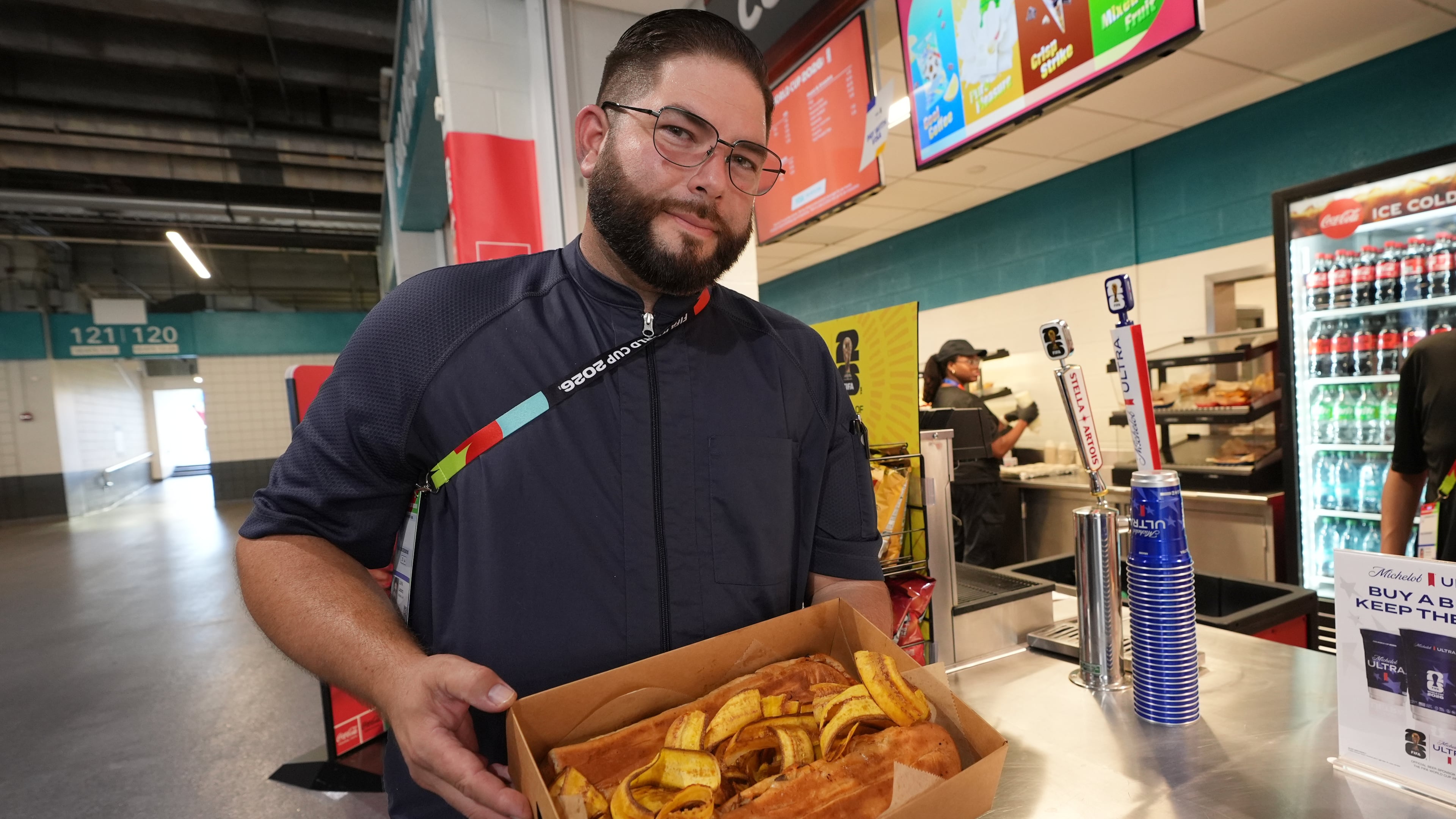 Lazaro Luya, the concession chef at Sol Cubano, displays their special, pan with lechon and fresh mariquitas at Miami Stadium Sunday, June 21, 2026, in Miami Gardens, Fla. (AP Photo/Marta Lavandier)
