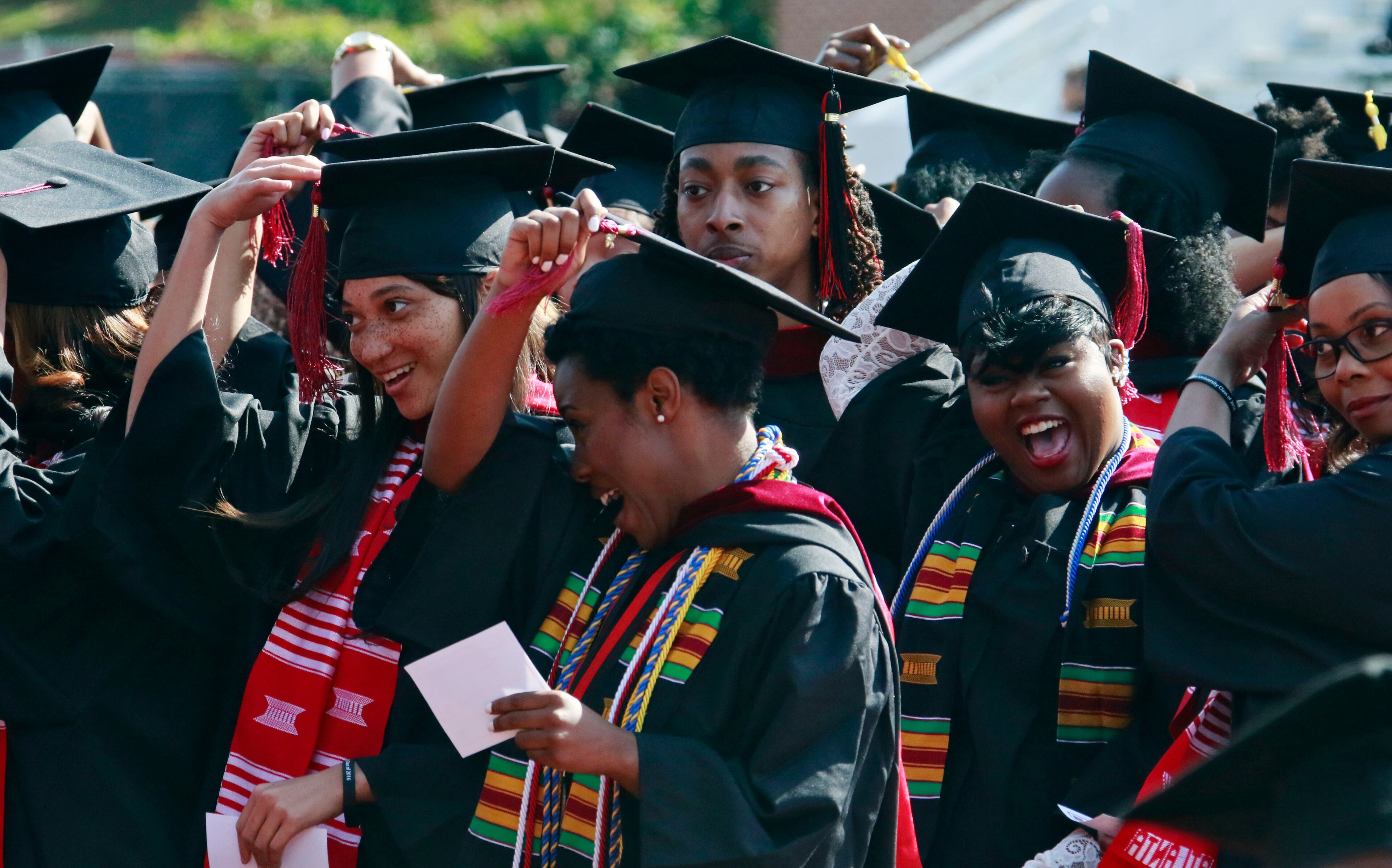 May 16, 2016 - Atlanta - Graduates move their tassels as their degrees are conferred. Clark Atlanta University class of 2016 filled Panther Stadium Monday morning for it's 27th annual Commencement Service. The keynote speaker was retired astronaut Mae Jemison, the first woman of color in Space. Honorary degrees were awarded to Hamilton Bohannon, a 1964 graduate of Clark College; Roland Carter; Congressman John Conyers, and Congressman Hank Johnson, a 1976 Clark College graduate. BOB ANDRES / BANDRES@AJC.COM