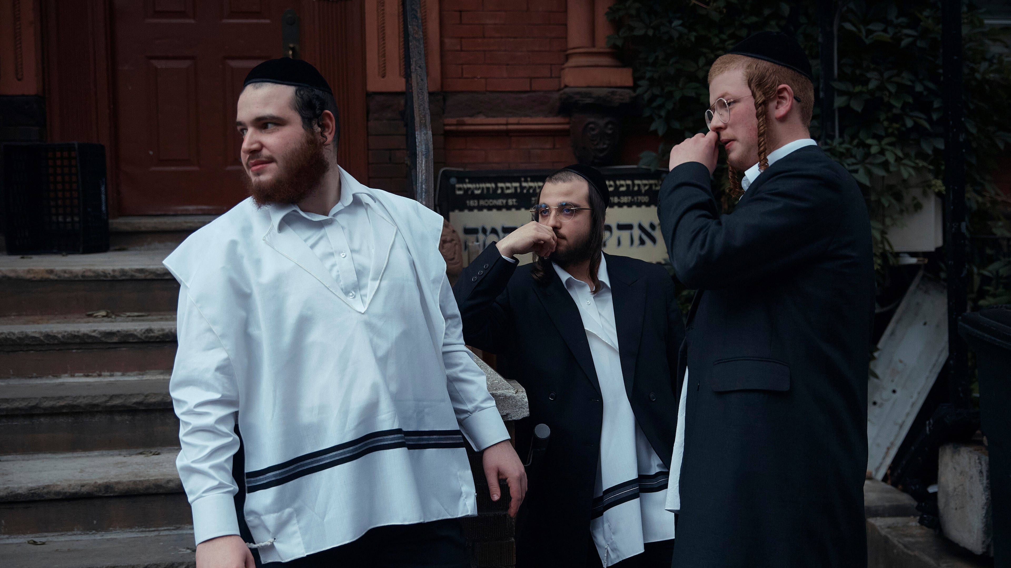 FILE - Hasidic Jewish men chat on June 16, 2025, in the Brooklyn borough of New York. (AP Photo/Andres Kudacki, File)