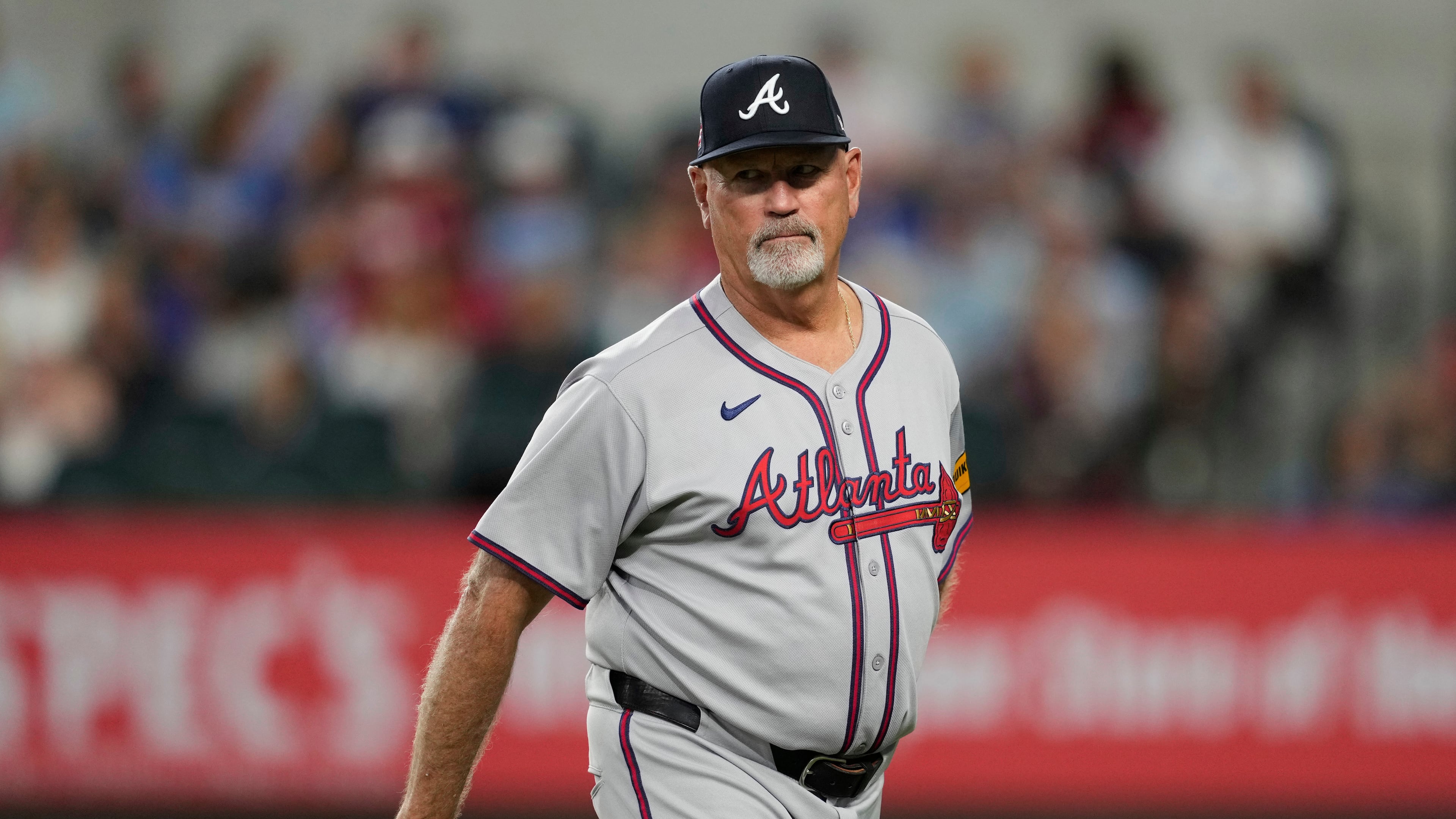 FILE - Atlanta Braves manager Brian Snitker walks back to the dugout after making a pitching change in the sixth inning of a baseball game against the Texas Rangers, Sunday, July 27, 2025, in Arlington, Texas. (AP Photo/Tony Gutierrez,File)