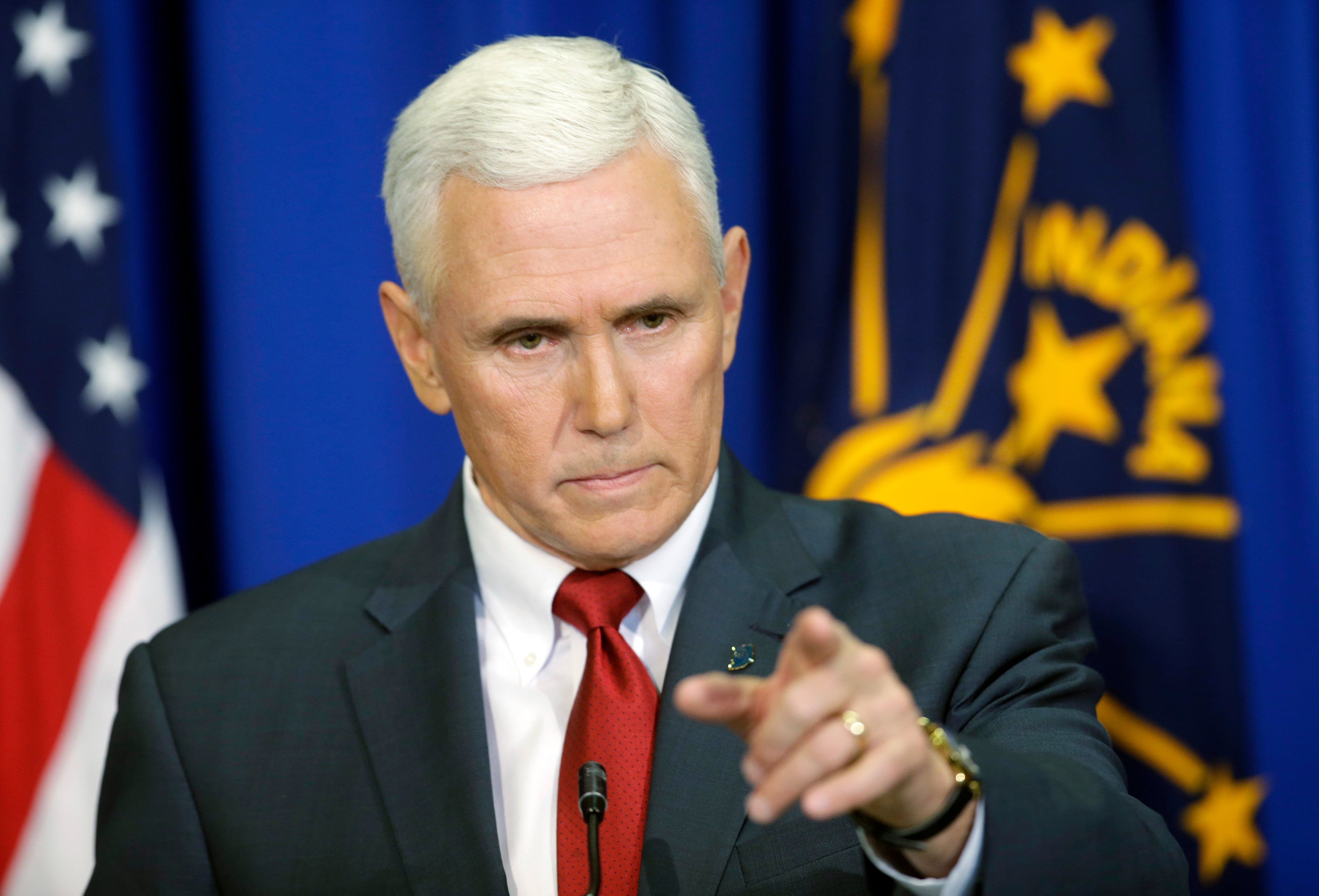 Indiana Gov. Mike Pence takes a question during a news conference, Tuesday, March 31, 2015, in Indianapolis. Pence said that he wants legislation on his desk by the end of the week to clarify that the state's new religious-freedom law does not allow discrimination against gays and lesbians. (AP Photo/Darron Cummings)