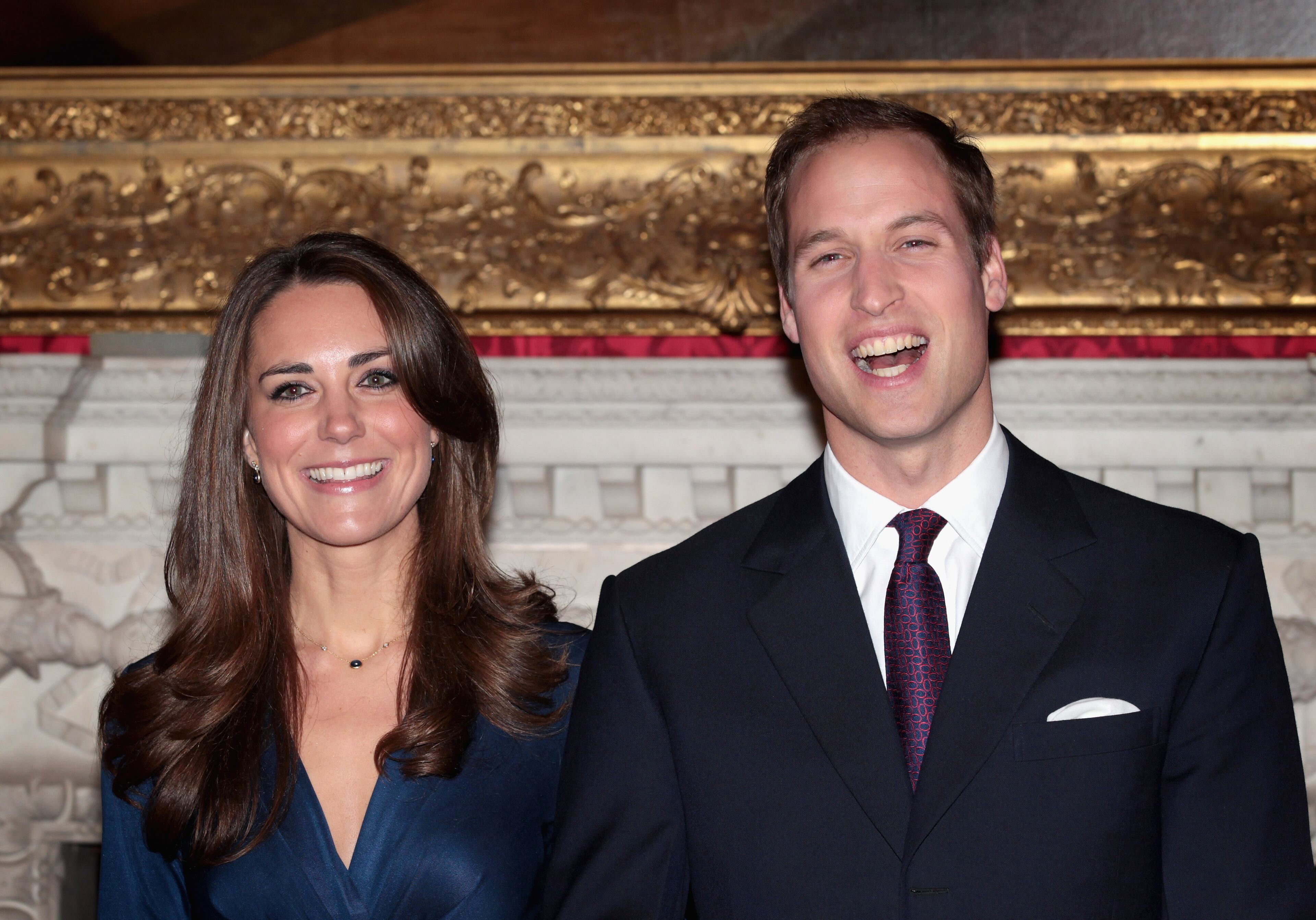 Prince William and Kate Middleton pose for photographs in the State Apartments of St James Palace on November 16, 2010 in London, England. After much speculation, Clarence House today announced the engagement of Prince William to Kate Middleton. The couple will get married in either the Spring or Summer of next year and continue to live in North Wales while Prince William works as an air sea rescue pilot for the RAF. The couple became engaged during a recent holiday in Kenya having been together for eight years. (Photo by Chris Jackson/Getty Images)