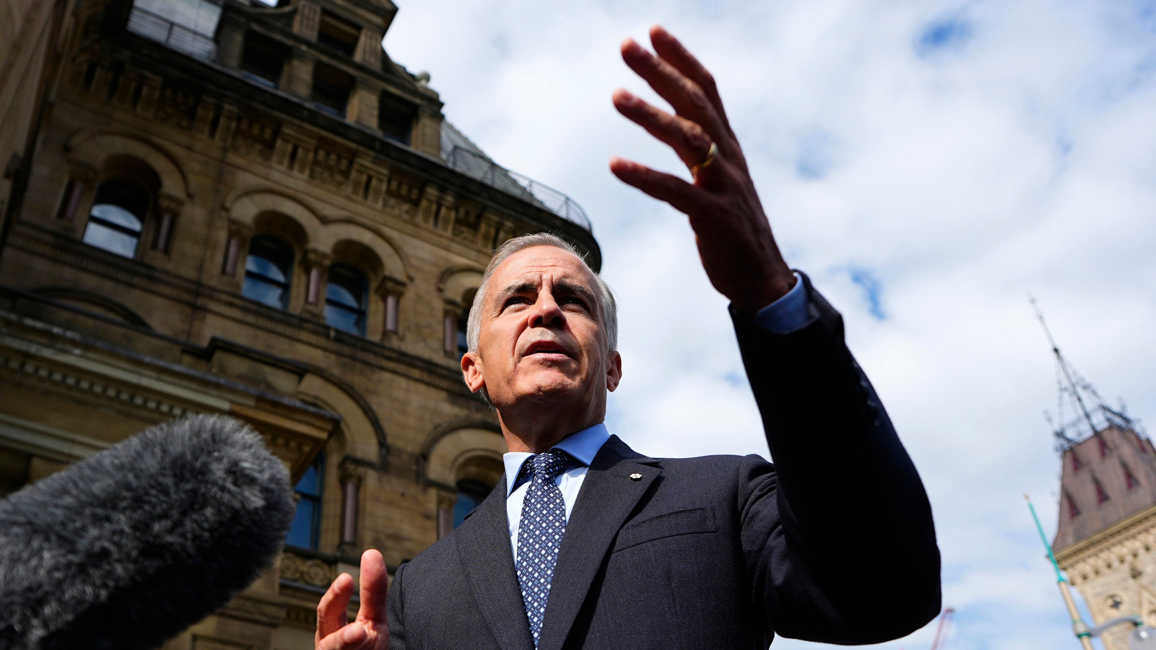 Prime Minister Mark Carney speaks to journalists as he arrives at the Office of the Prime Minister and Privy Council in Ottawa, on Tuesday, Sept. 1, 2026. (Justin Tang/The Canadian Press via AP)