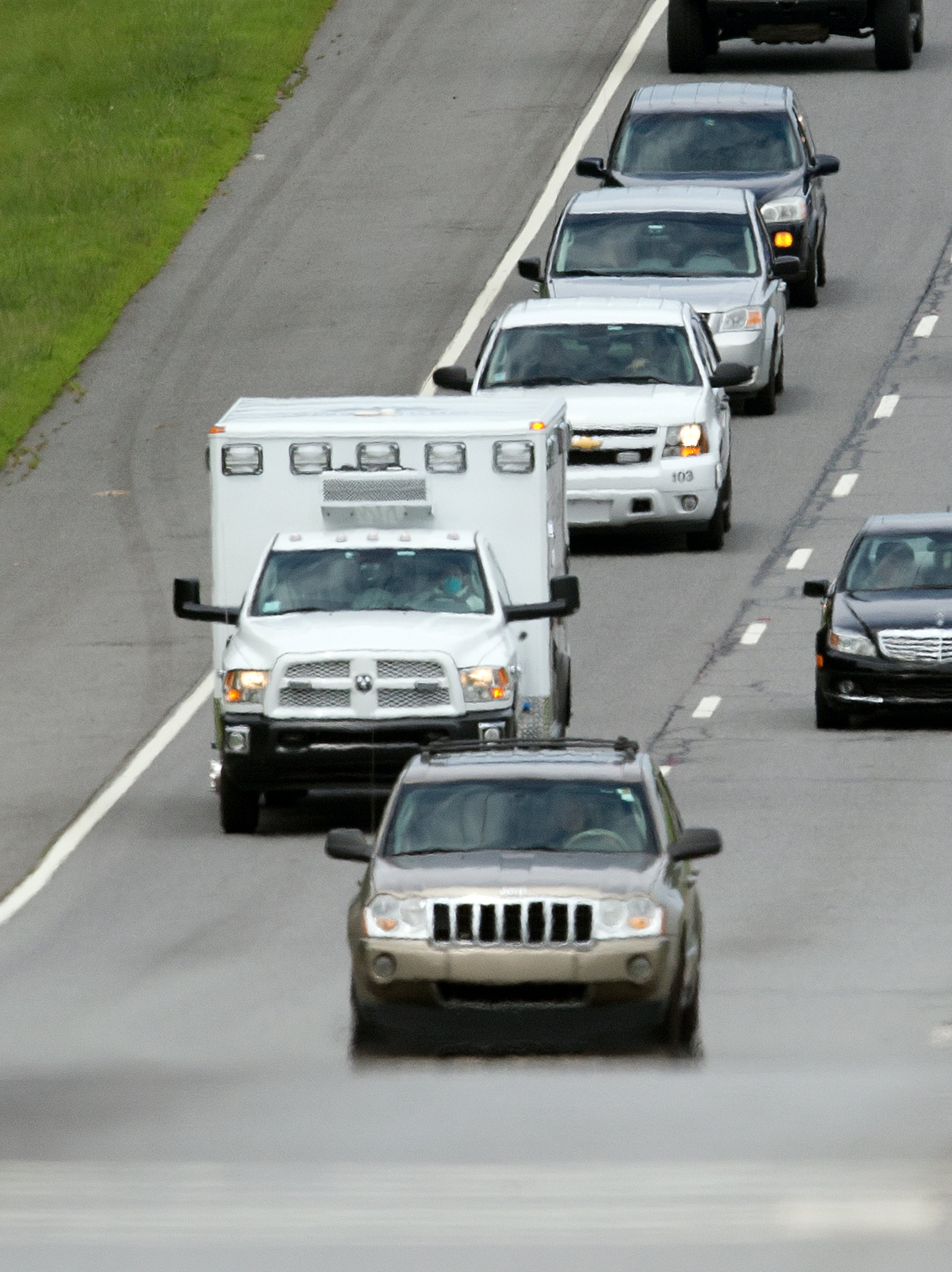 An ambulance is shown en route to Emory University Hospital after departing from Dobbins Air Reserve Base in Marietta., Ga., Saturday, Aug. 2, 2014. Officials at Emory in Atlanta expect an American who is infected with the Ebola virus to be transported for treatment today. (AP Photo/John Bazemore)