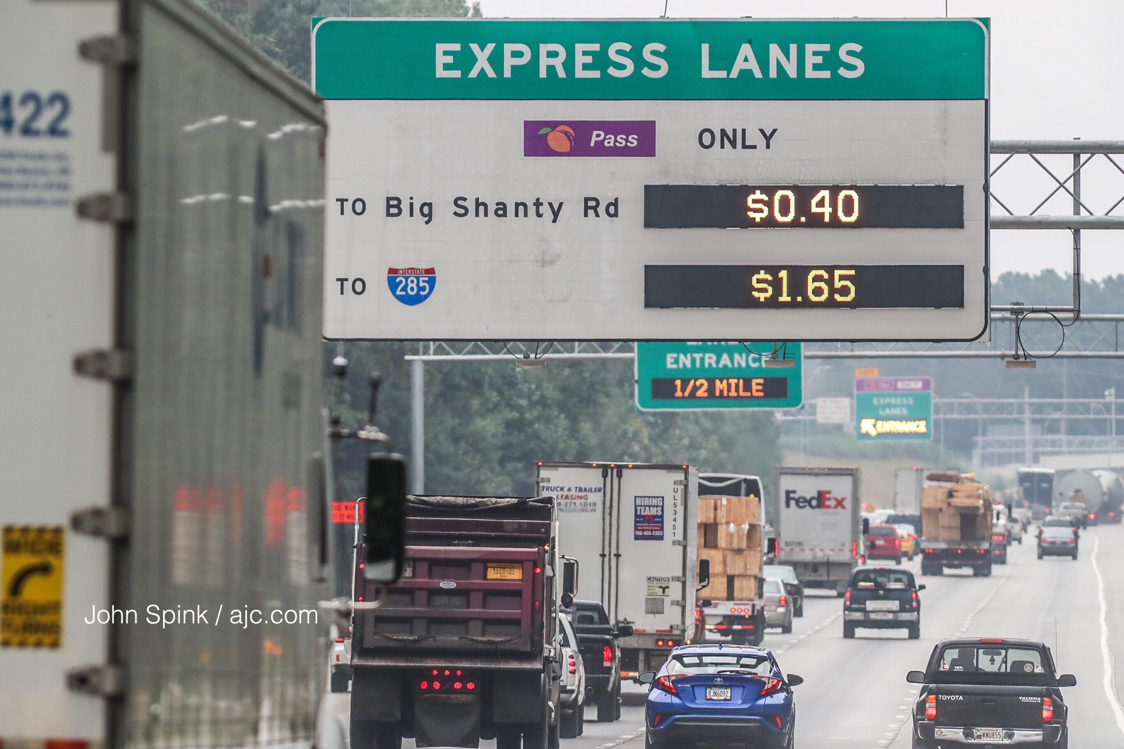 Monday was the first morning that drivers had to pay to use the Northwest Corridor Express Lanes in Cobb County. JOHN SPINK / JSPINK@AJC.COM